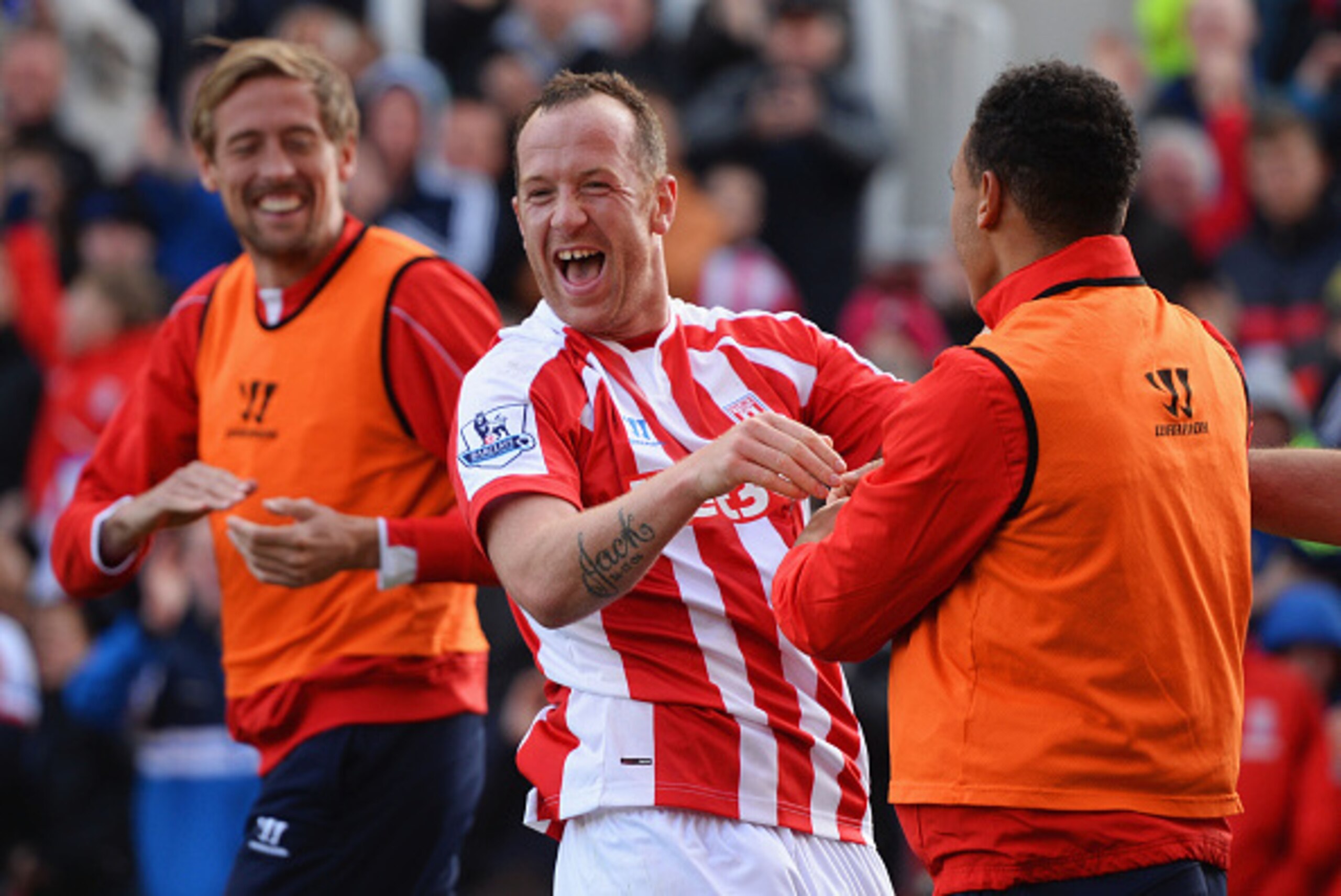 STOKE ON TRENT, ENGLAND - APRIL 25:  Charlie Adam of Stoke City (C) celebrates scoring their first goal with Peter Crouch and Peter Odemwingie of Stoke City during the Barclays Premier League match between Stoke City and Sunderland at Britannia Stadium on