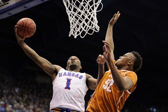 LAWRENCE, KS - FEBRUARY 28: Wayne Selden Jr. #1 of the Kansas Jayhawks lays the ball up against Myles Turner #52 of the Texas Longhorns in the first half at Allen Fieldhouse on February 28, 2015 in Lawrence, Kansas. (Photo by Ed Zurga/Getty Images)