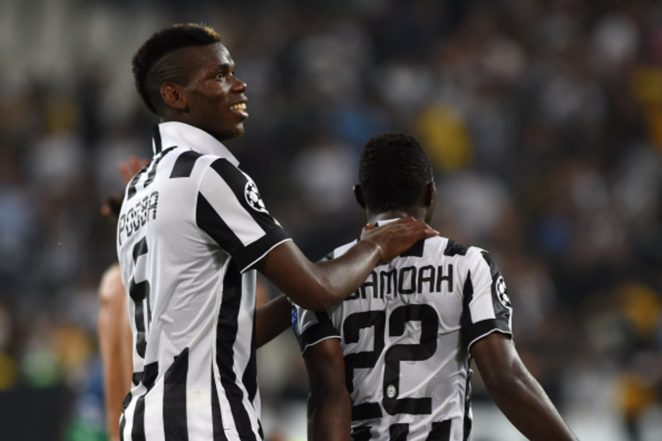 TURIN, ITALY - SEPTEMBER 16: Paul Pogba (L) of Juventus celebrate victory with Kwadwo Asamoah at the end of the UEFA Champions League Group A match between Juventus and Malmo FF on September 16, 2014 in Turin, Italy. (Photo by Valerio Pennicino/Getty Im TURIN, ITALY - SEPTEMBER 16: Paul Pogba (L) of Juventus celebrate victory with Kwadwo Asamoah at the end of the UEFA Champions League Group A match between Juventus and Malmo FF on September 16, 2014 in Turin, Italy. (Photo by Valerio Pennicino/Getty Im
