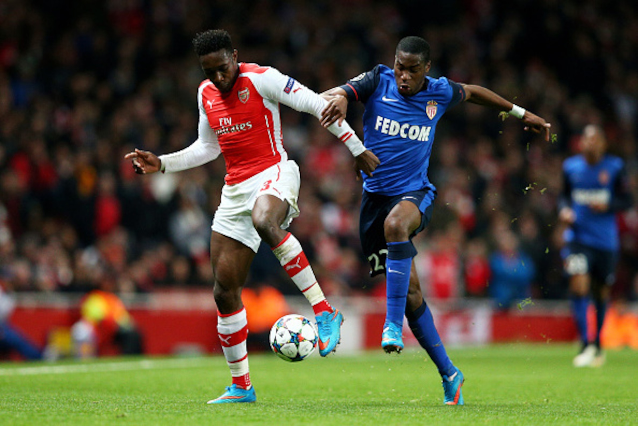 LONDON, ENGLAND - FEBRUARY 25:  Danny Welbeck of Arsenal and Geoffrey Kondogbia of Monaco battle for the ball during the UEFA Champions League round of 16, first leg match between Arsenal and Monaco at The Emirates Stadium on February 25, 2015 in London, 