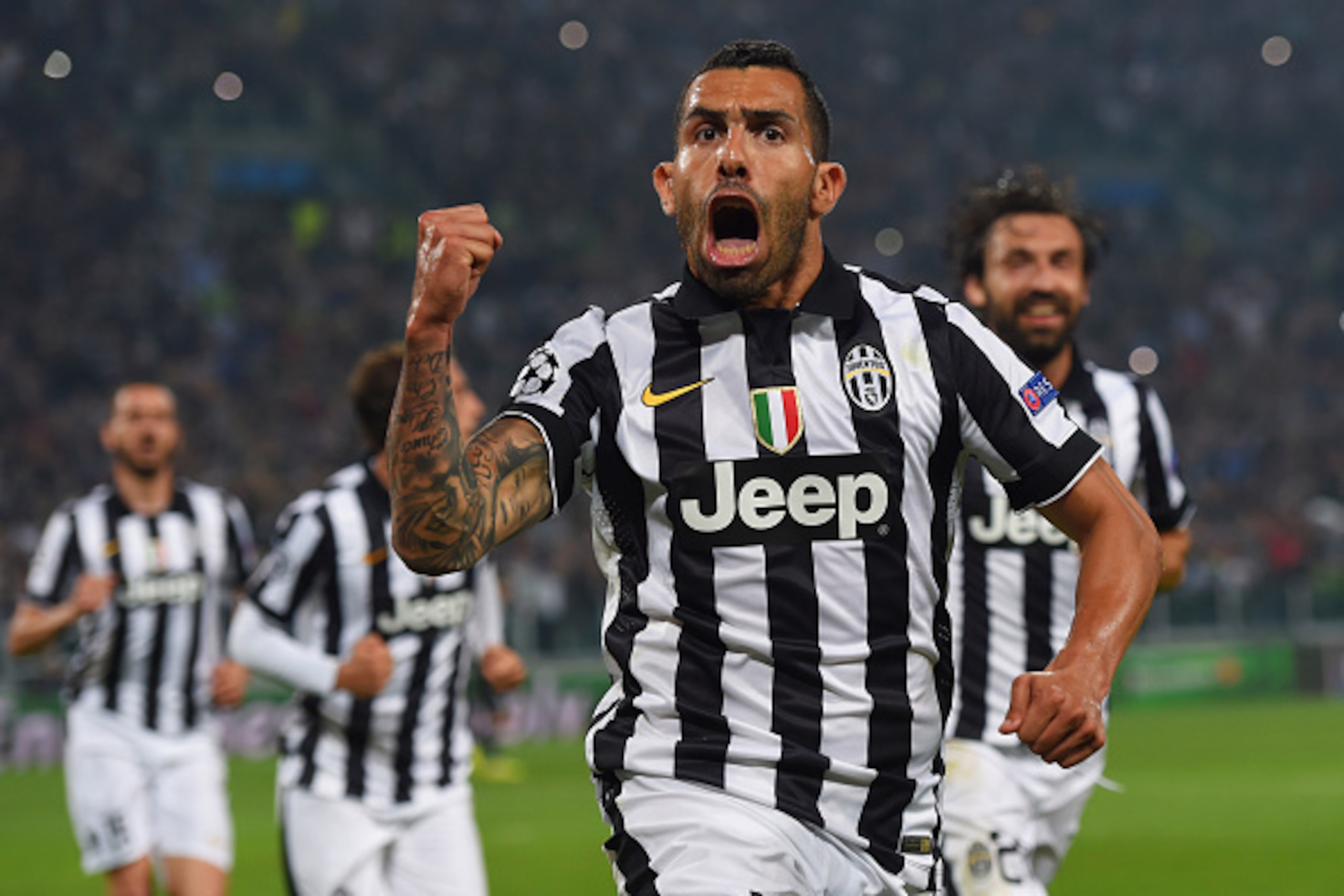 TURIN, ENGLAND - MAY 05:  Carlos Tevez of Juventus celebrates as he scores their second goal from a penalty during the UEFA Champions League semi final first leg match between Juventus and Real Madrid CF at Juventus Arena on May 5, 2015 in Turin, Italy.  
