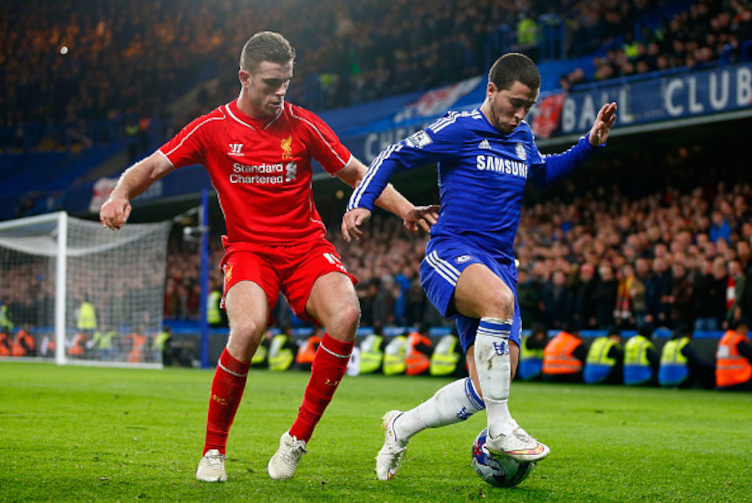 LONDON, ENGLAND - JANUARY 27:  Jordan Henderson of Liverpool marshalls Eden Hazard of Chelsea during the Capital One Cup Semi-Final second leg between Chelsea and Liverpool at Stamford Bridge on January 27, 2015 in London, England.  (Photo by Julian Finne