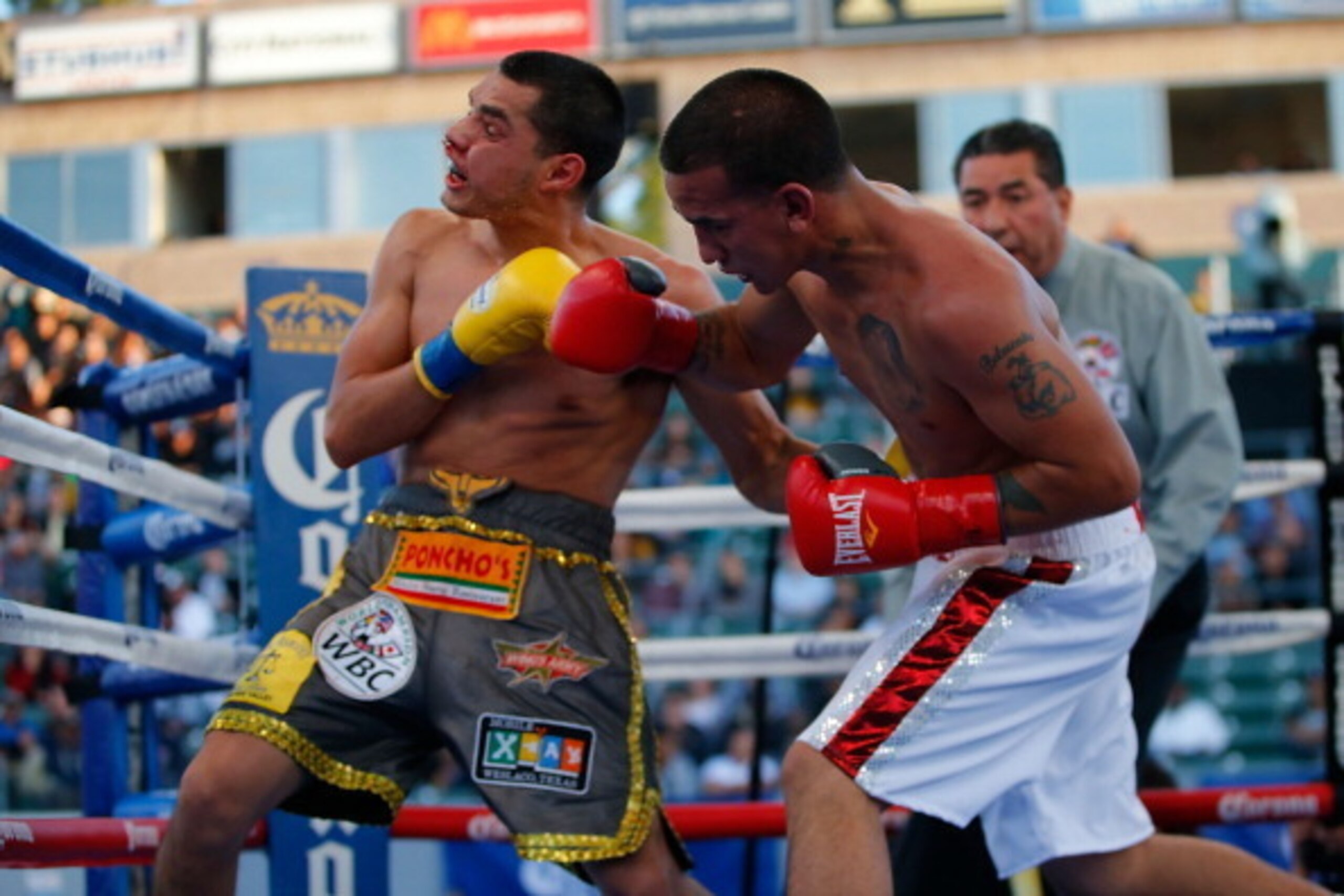 LOS ANGELES, CA - APRIL 26:  Jerry Belmontes punches Omar Figueroa Jr. during their WBC Lightweight World Championship title bout at StubHub Center on April 26, 2014 in Los Angeles, California.  (Photo by Joe Scarnici/Getty Images)
