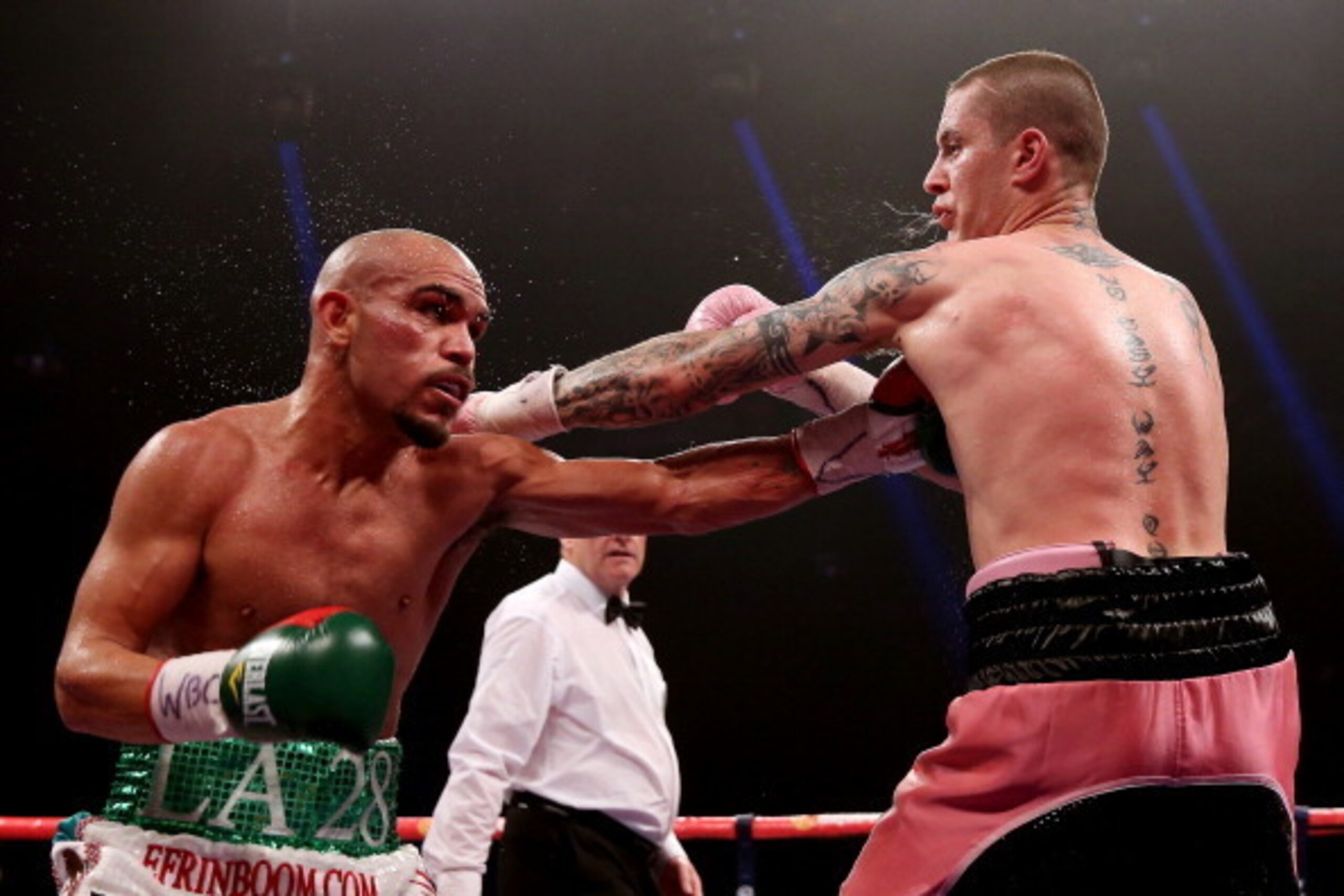 GLASGOW, SCOTLAND - SEPTEMBER 07:  Ricky Burns (R) in action with Raymundo Beltran during their WBO World Lightweight Title bout at SECC on September 7, 2013 in Glasgow, Scotland.  (Photo by Scott Heavey/Getty Images)