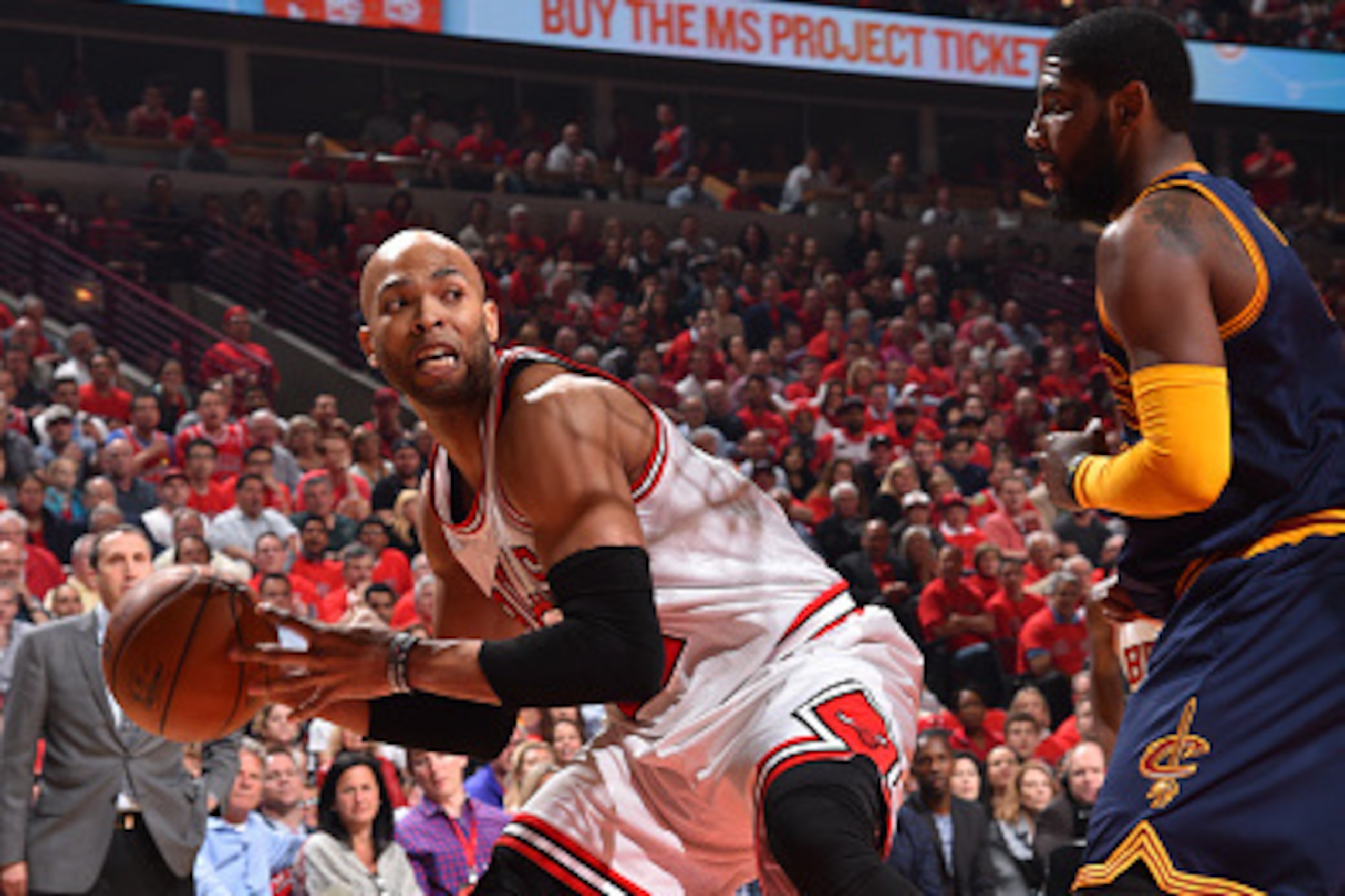 CHICAGO,IL : Taj Gibson #22 of the Chicago Bulls looks to pass the ball against the Cleveland Cavaliers at the United Center During Game Two of the Eastern Conference Semifinals during the 2015 NBA Playoffs on May 8, 2015 in Chicago,Illinois NOTE TO USER: