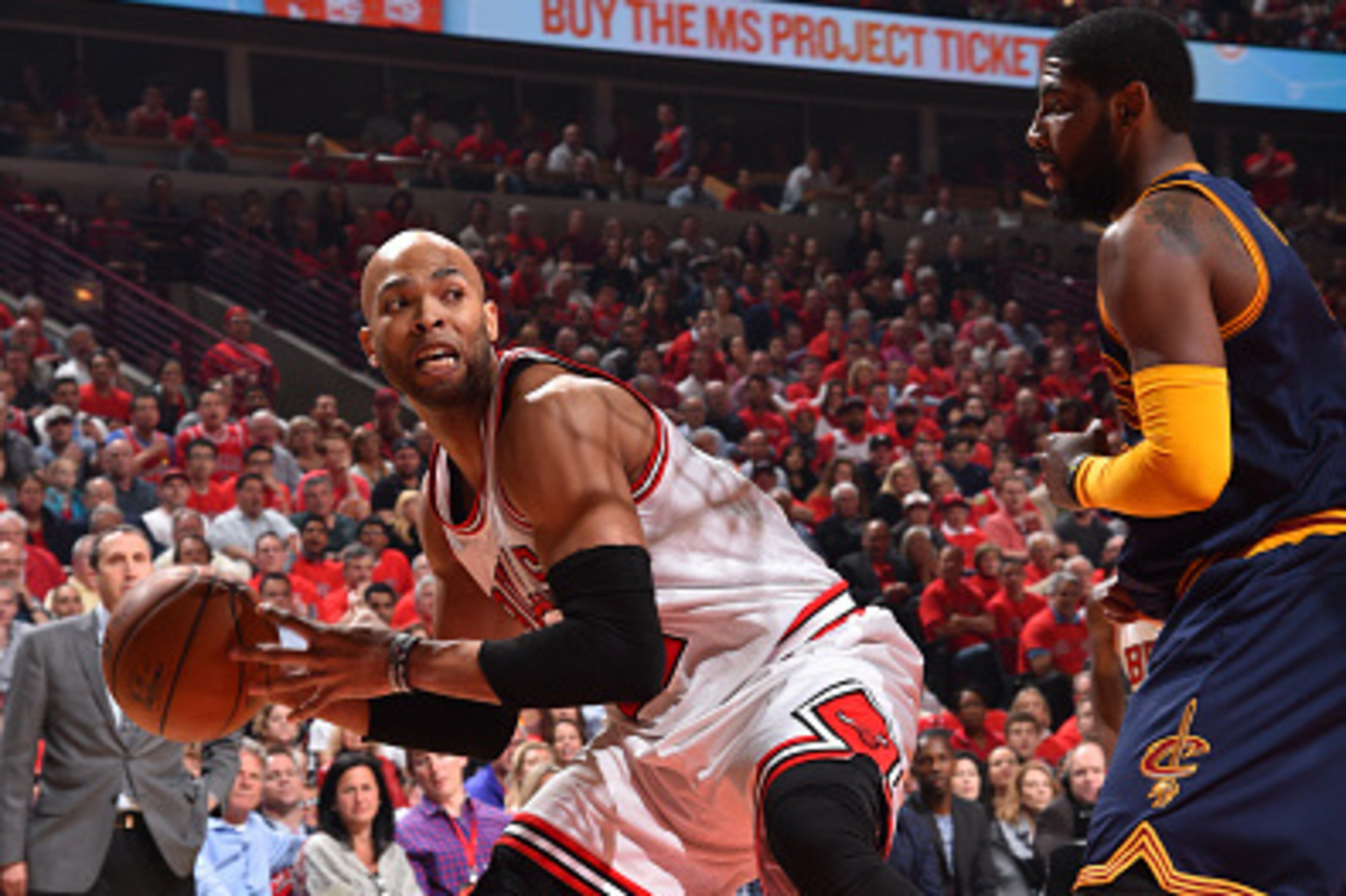 CHICAGO,IL : Taj Gibson #22 of the Chicago Bulls looks to pass the ball against the Cleveland Cavaliers at the United Center During Game Two of the Eastern Conference Semifinals during the 2015 NBA Playoffs on May 8, 2015 in Chicago,Illinois NOTE TO USER: