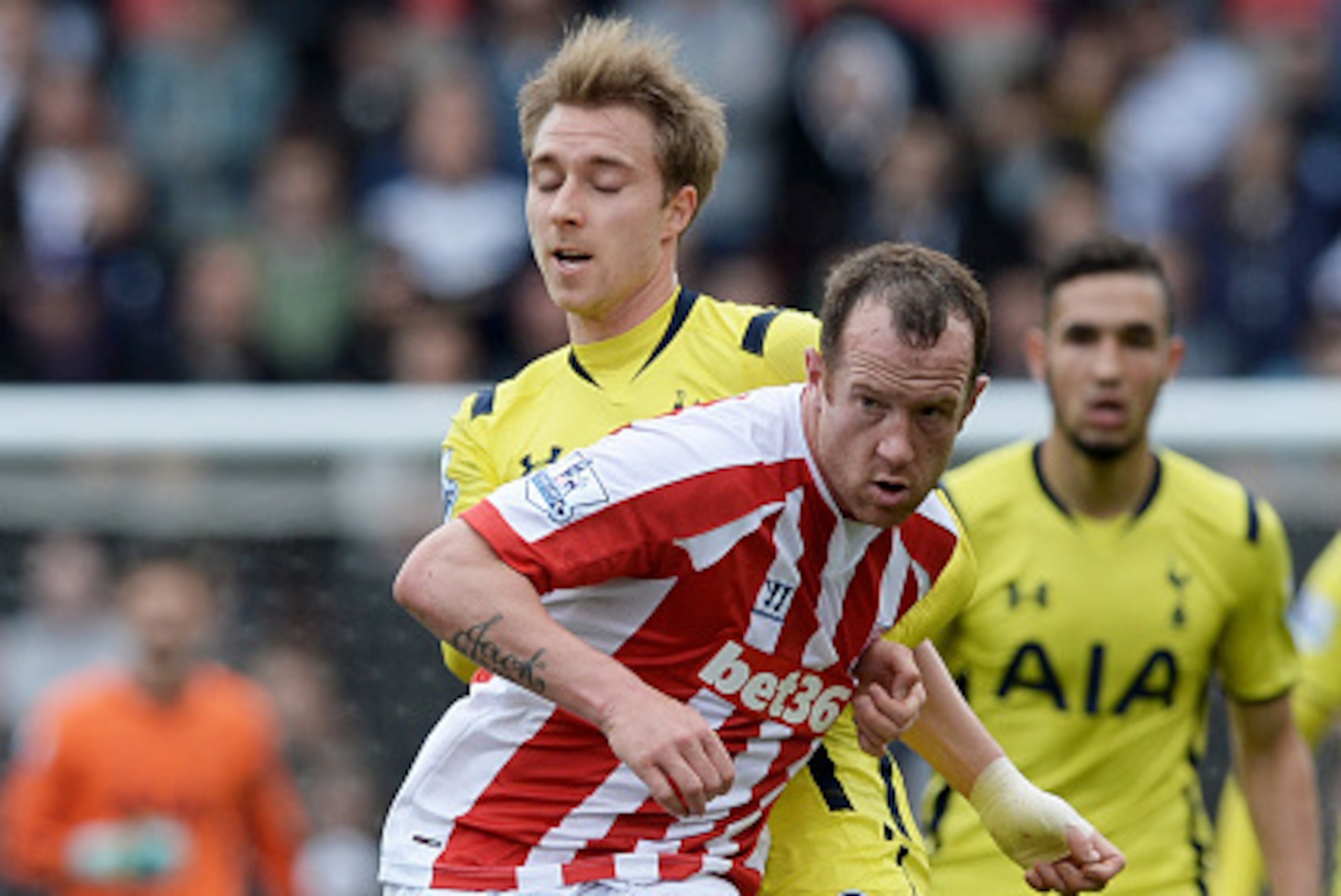 STOKE ON TRENT, ENGLAND - MAY 09:  Charlie Adam of Stoke City holds off Christian Eriksen of Spurs during the Barclays Premier League match between Stoke City and Tottenham Hotspur at Britannia Stadium on May 9, 2015 in Stoke on Trent, England.  (Photo by