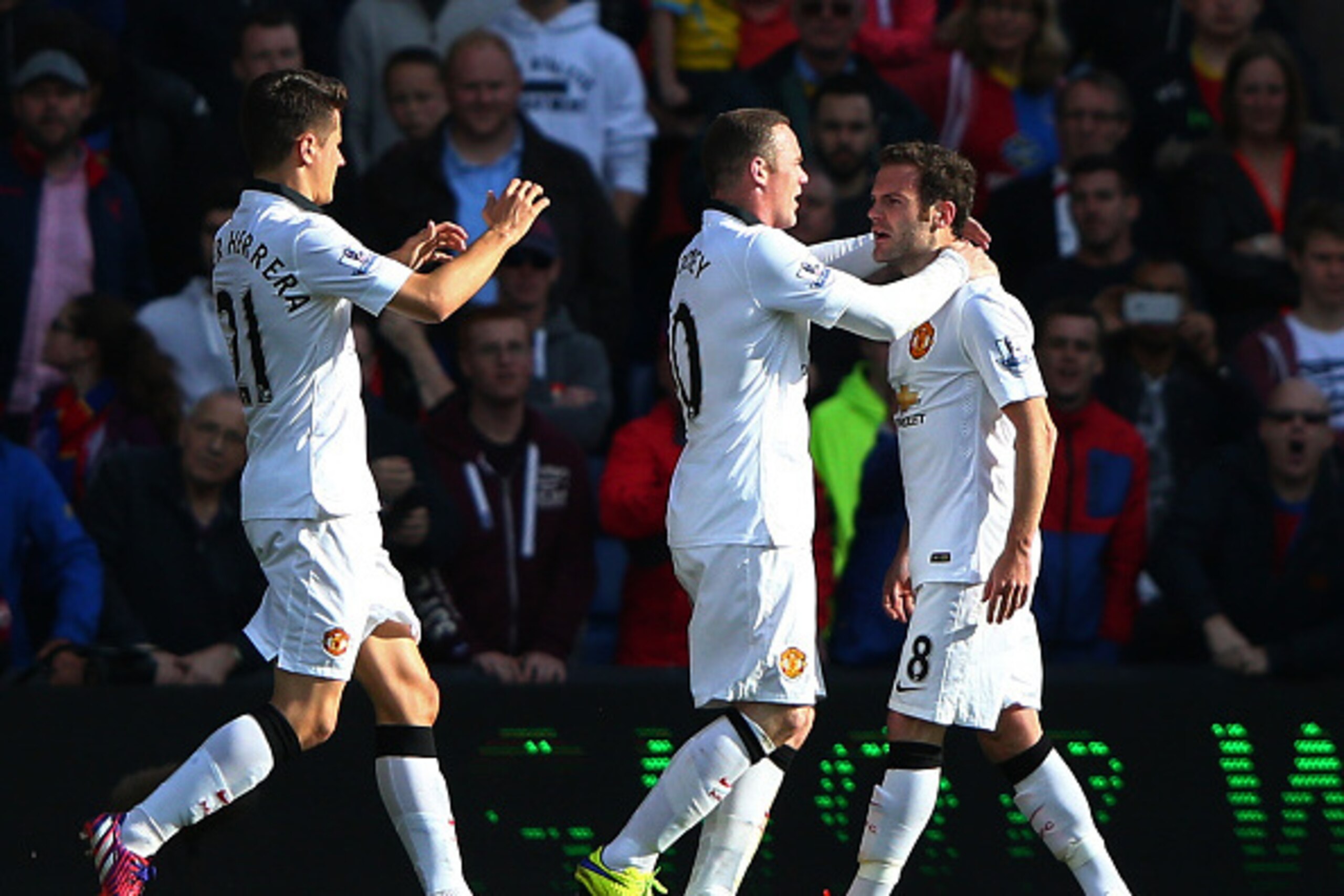 LONDON, ENGLAND - MAY 09:  Juan Mata (R) of Manchester United celebrates scoring his penalty with Wayne Rooney and Ander Herrera during the Barclays Premier League match between Crystal Palace and Manchester United at Selhurst Park on May 9, 2015 in Londo