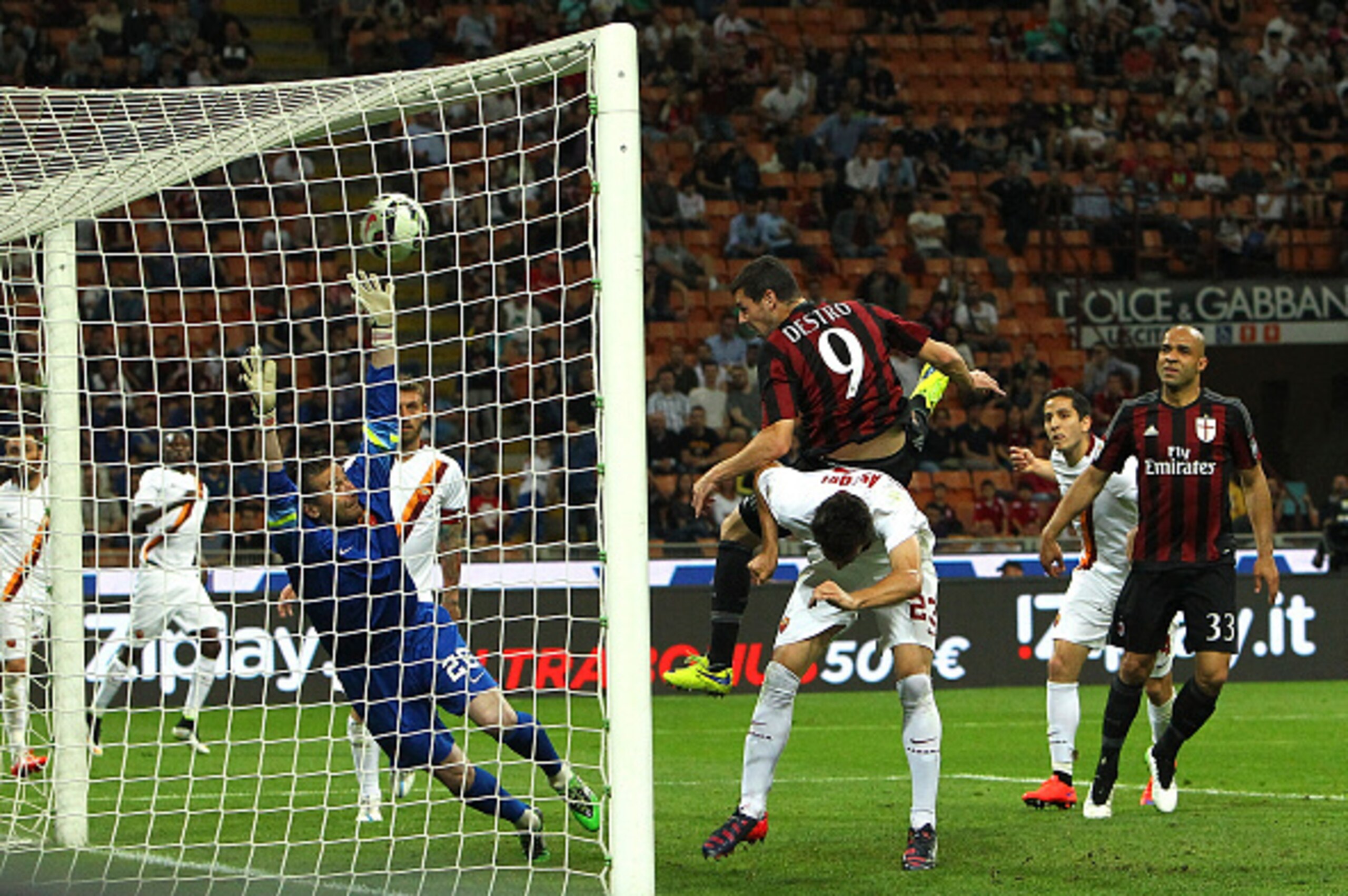 MILAN, ITALY - MAY 09:  Mattia Destro #9 of AC Milan scores a goal during the Serie a match between AC Milan and AS Roma at Stadio Giuseppe Meazza on May 9, 2015 in Milan, Italy.  (Photo by Marco Luzzani/Getty Images)