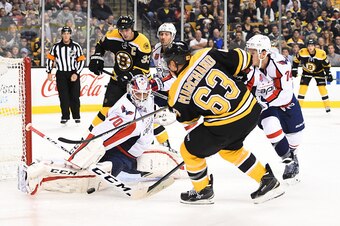 BOSTON, MA - OCTOBER 11 : Brad Marchand #63 of the Boston Bruins shoots the puck against Braden Holtby #70 of the Washington Capitals at the TD Garden on October 11, 2014 in Boston, Massachusetts.  (Photo by Brian Babineau/NHLI via Getty Images)