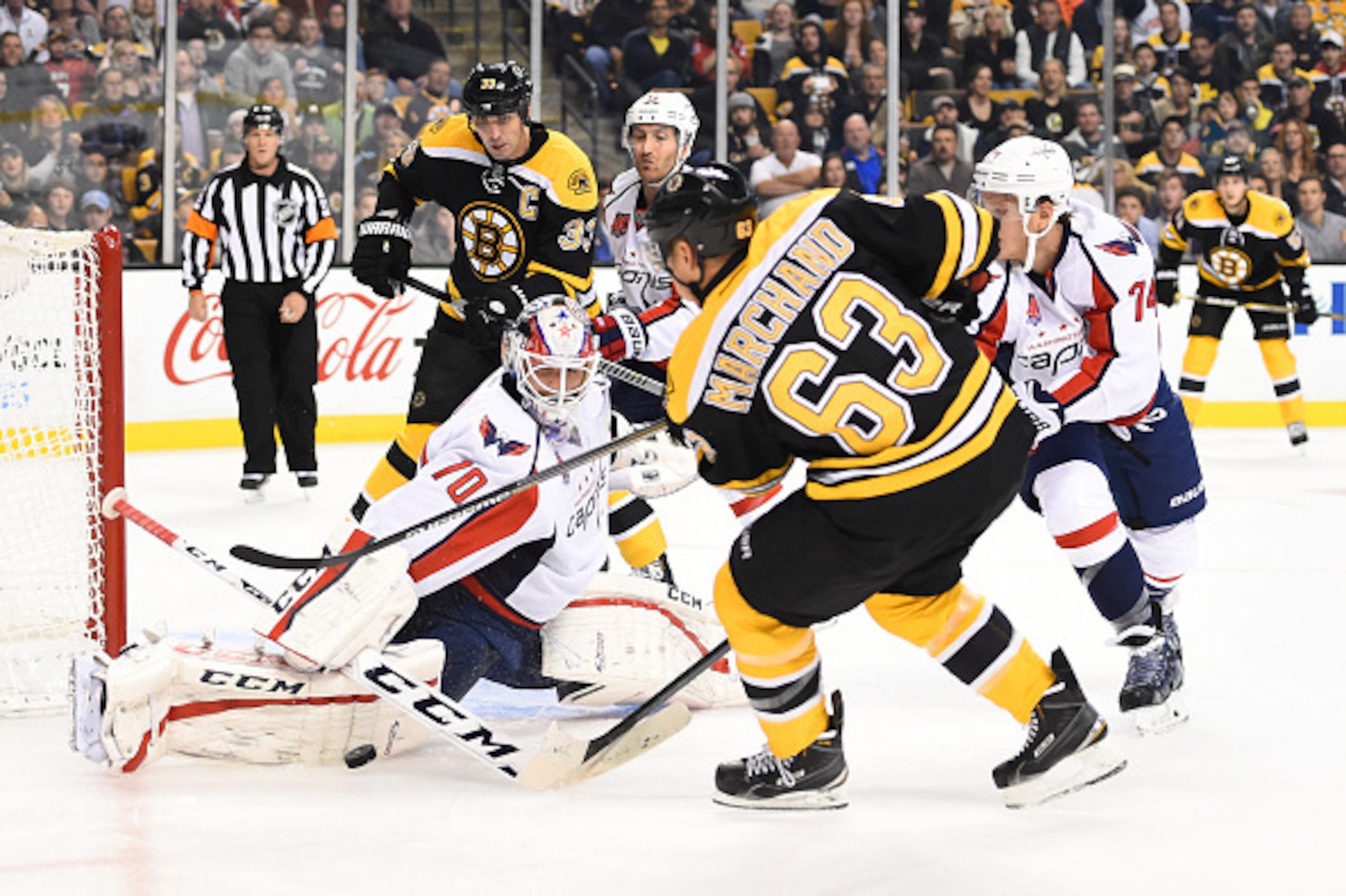 BOSTON, MA - OCTOBER 11 : Brad Marchand #63 of the Boston Bruins shoots the puck against Braden Holtby #70 of the Washington Capitals at the TD Garden on October 11, 2014 in Boston, Massachusetts.  (Photo by Brian Babineau/NHLI via Getty Images)