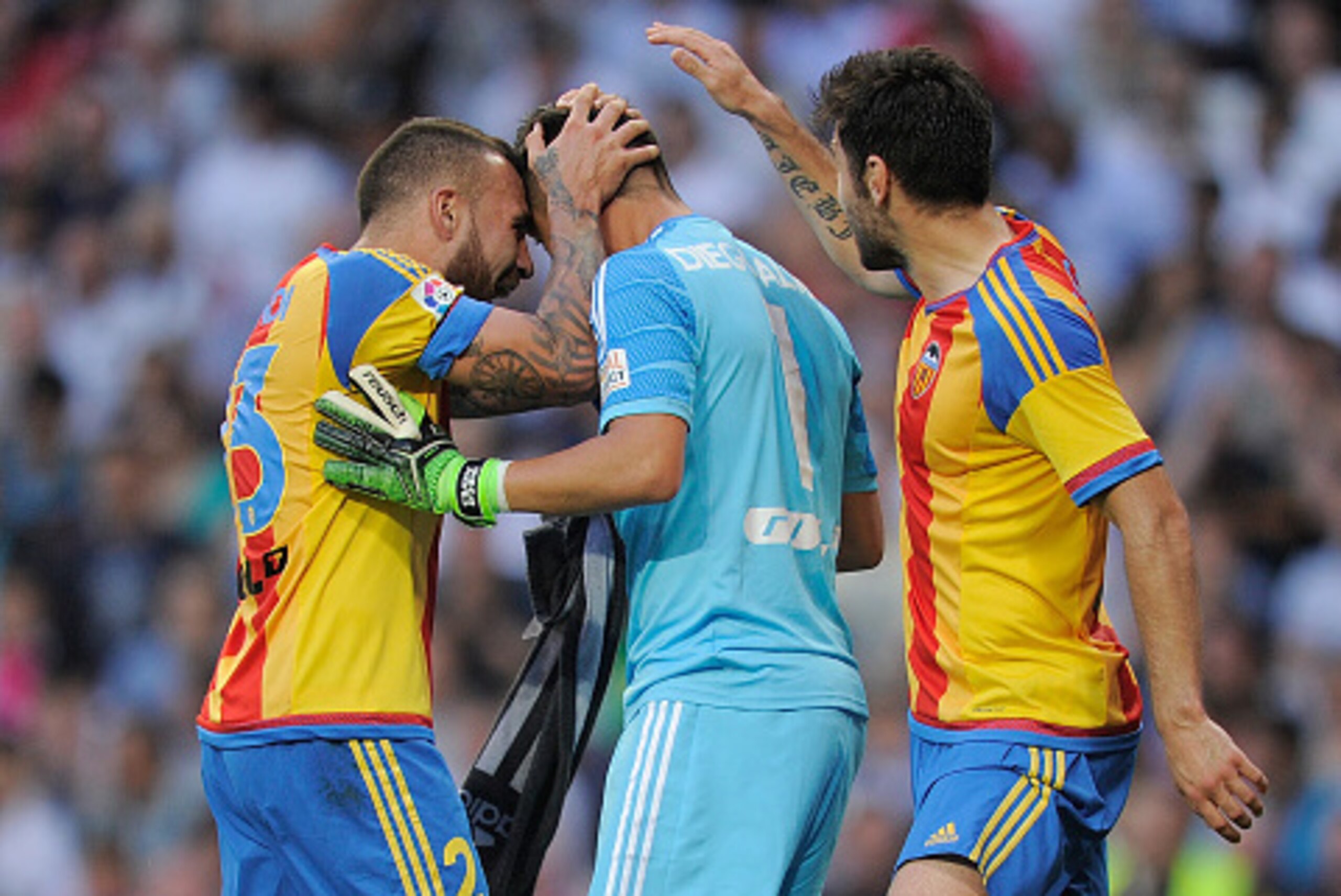 MADRID, SPAIN - MAY 09:  Diego Alves of Valencia CF is congratulated by teammates after saving a penalty kick from Cristiano Ronaldo during the La Liga match between Real Madrid CF and Valencia CF at Estadio Santiago Bernabeu on May 9, 2015 in Madrid, Spa