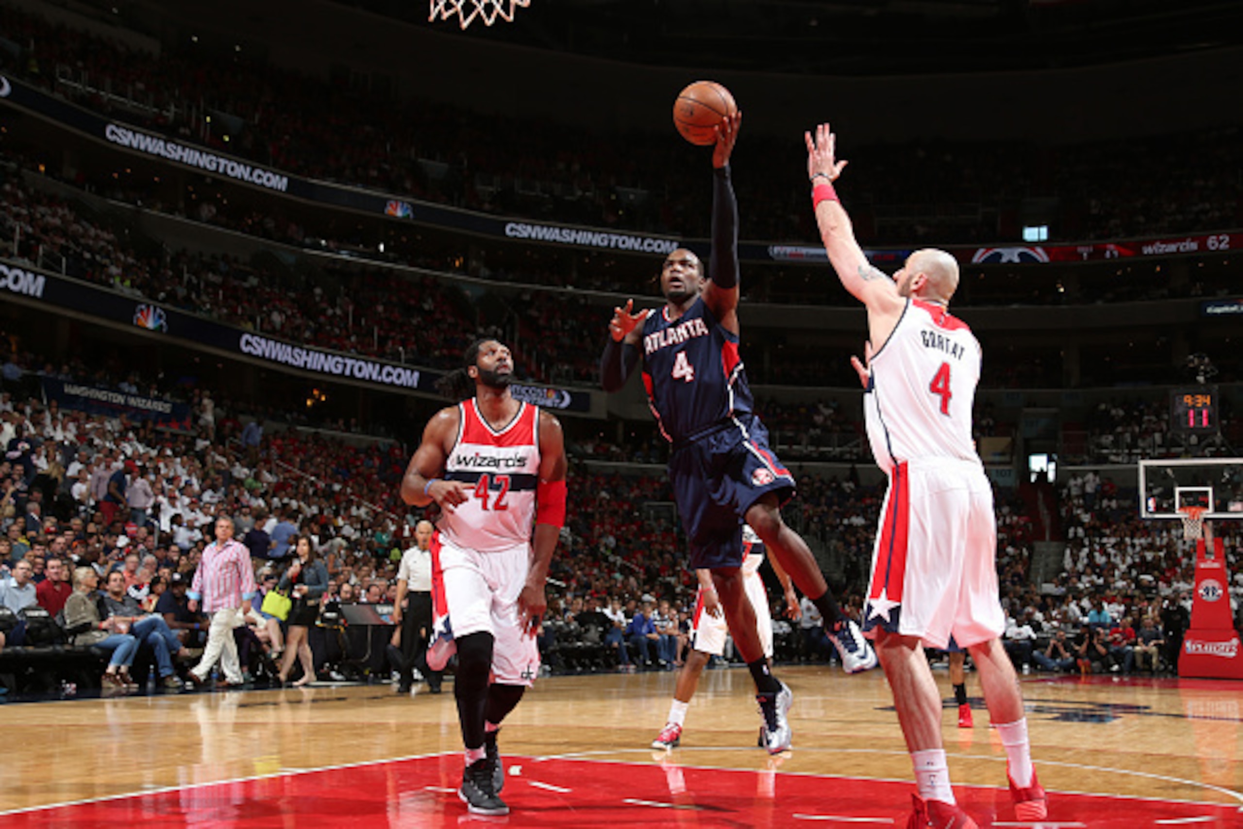 WASHINGTON, DC - MAY 9: Paul Millsap #4 of the Atlanta Hawks goes up for a shot against the Washington Wizards in Game Three of the Eastern Conference Semifinals of the 2015 NBA Playoffs at the Verizon Center on May 9, 2015 in Washington, DC. NOTE TO USER