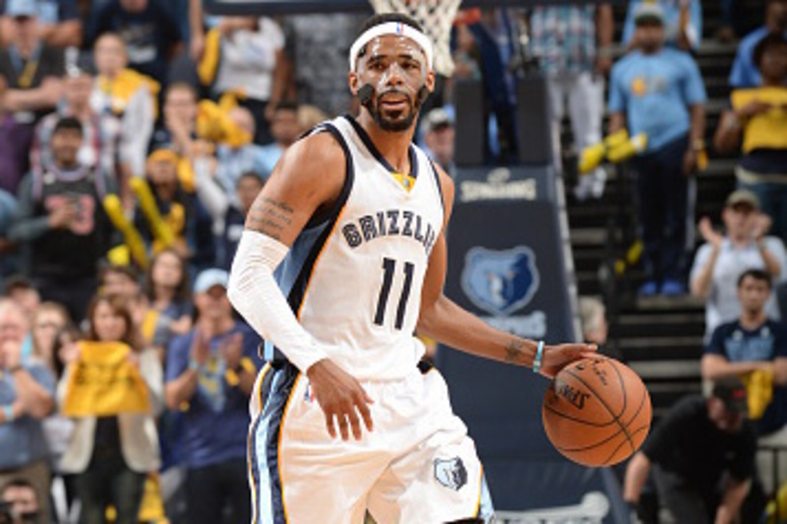 MEMPHIS, TN - MAY 9:  Mike Conley #11 of the Memphis Grizzlies drives to the basket against the Golden State Warriors in Game Three of the Western Conference Semifinals during the 2015 NBA Playoffs on May 9, 2015 at the FedExForum in Memphis, Tennessee.  
