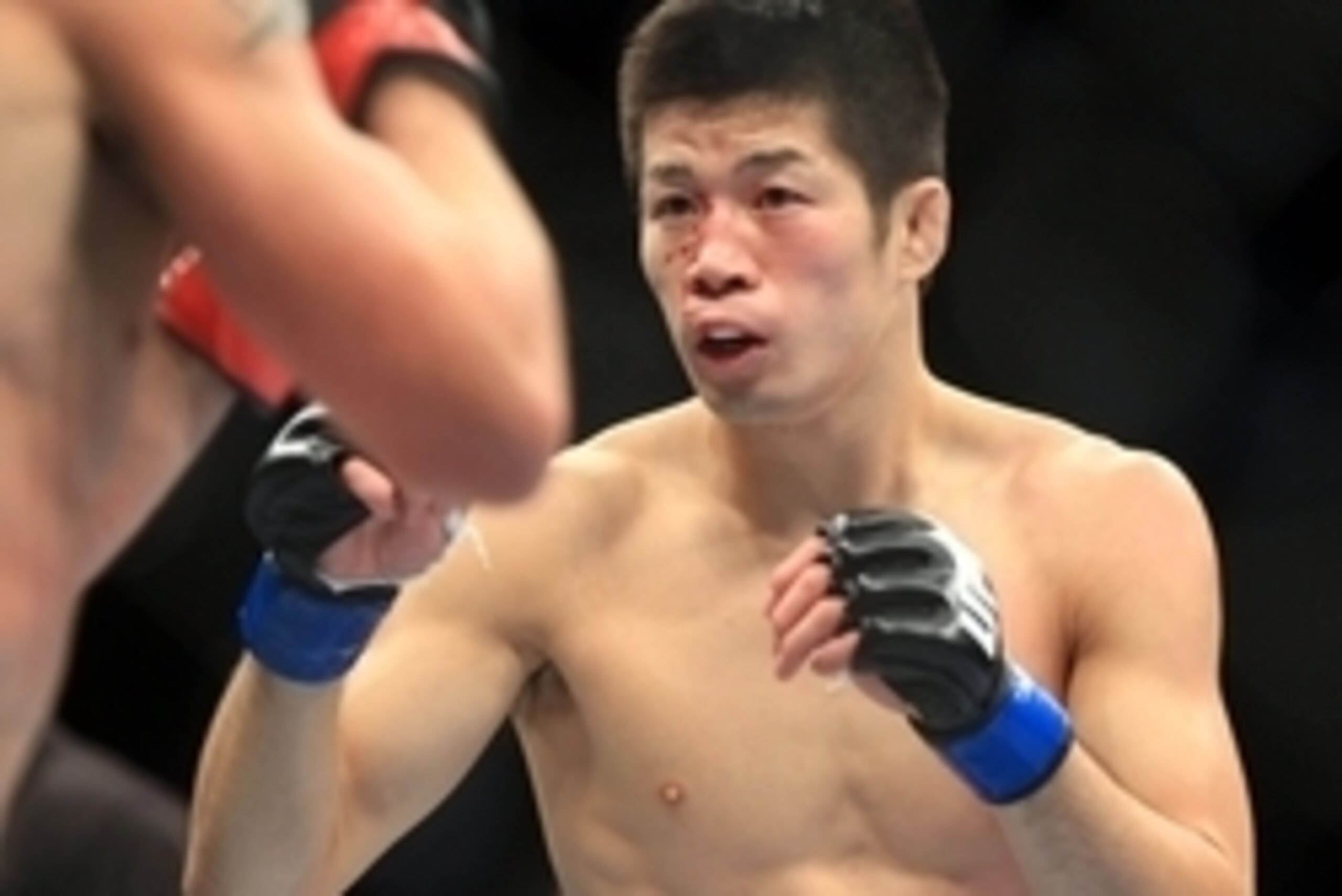 Aug 27, 2013; Indianapolis, IN, USA; Darren Elkins (red gloves) fights Hatsu Hioki (blue gloves) during UFC Fight Night 27 at Bankers Life Fieldhouse. Mandatory Credit: Pat Lovell-USA TODAY Sports Aug 27, 2013; Indianapolis, IN, USA; Darren Elkins (red gloves) fights Hatsu Hioki (blue gloves) during UFC Fight Night 27 at Bankers Life Fieldhouse. Mandatory Credit: Pat Lovell-USA TODAY Sports