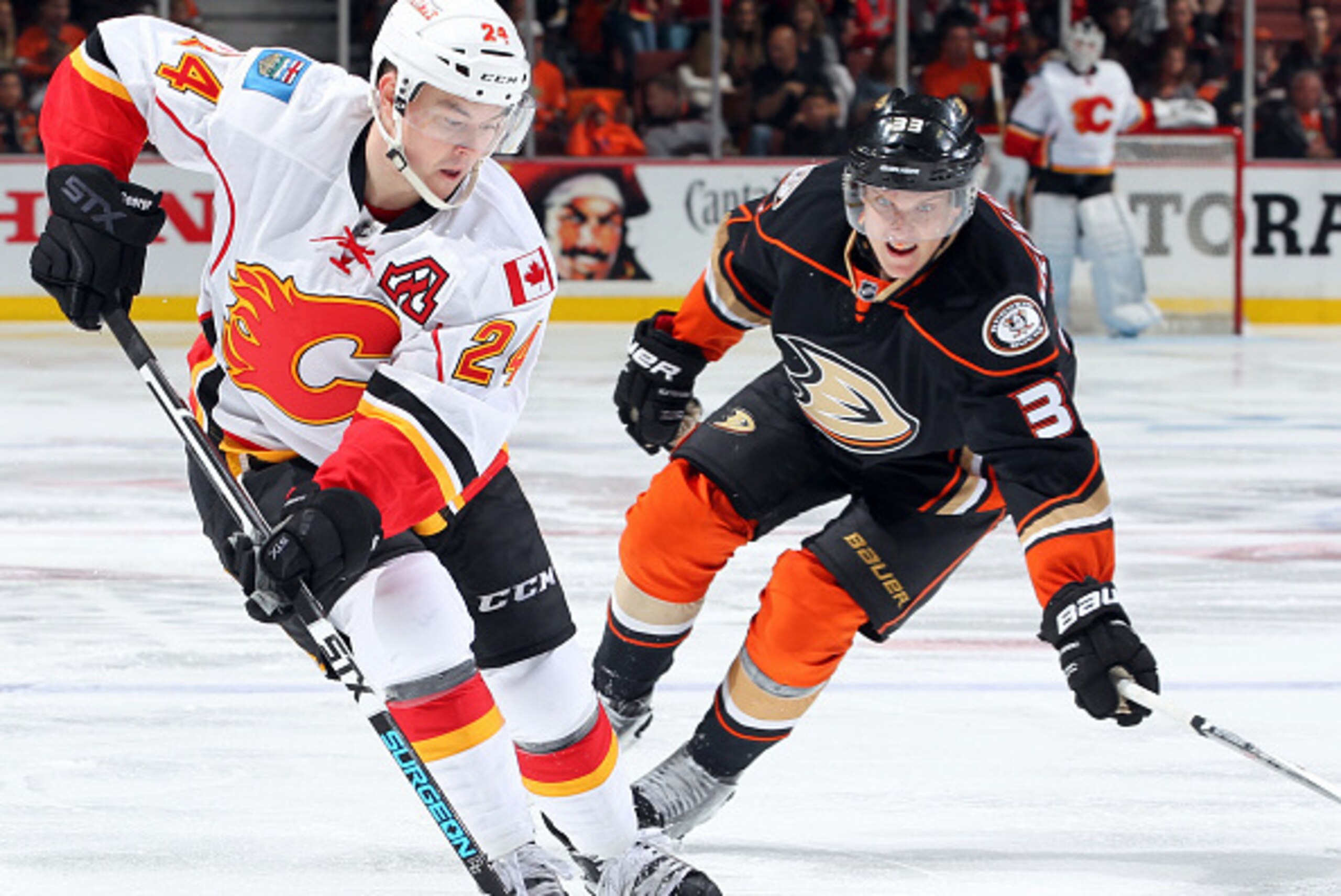 ANAHEIM, CA - MAY 3:  Jiri Hudler #24 of the Calgary Flames controls the puck in front of Jakob Silfverberg #33 of the Anaheim Ducks during the second period in Game Two of the Western Conference Semifinals during the 2015 NHL Stanley Cup Playoffs at Hond