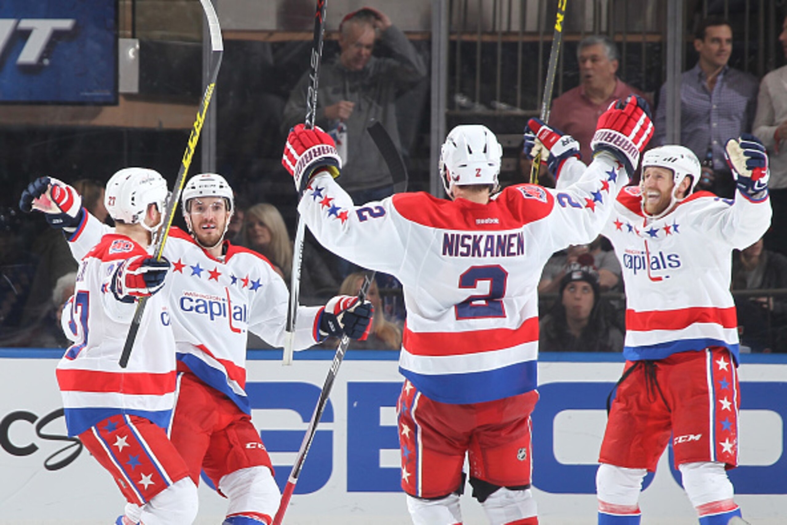 NEW YORK, NY - MAY 08:  Curtis Glencross #22 of the Washington Capitals celebrates his third period goal with Karl Alzner #27, Matt Niskanen #2 and Brooks Laich #21 against the New York Rangers in Game Five of the Eastern Conference Semifinals during the 