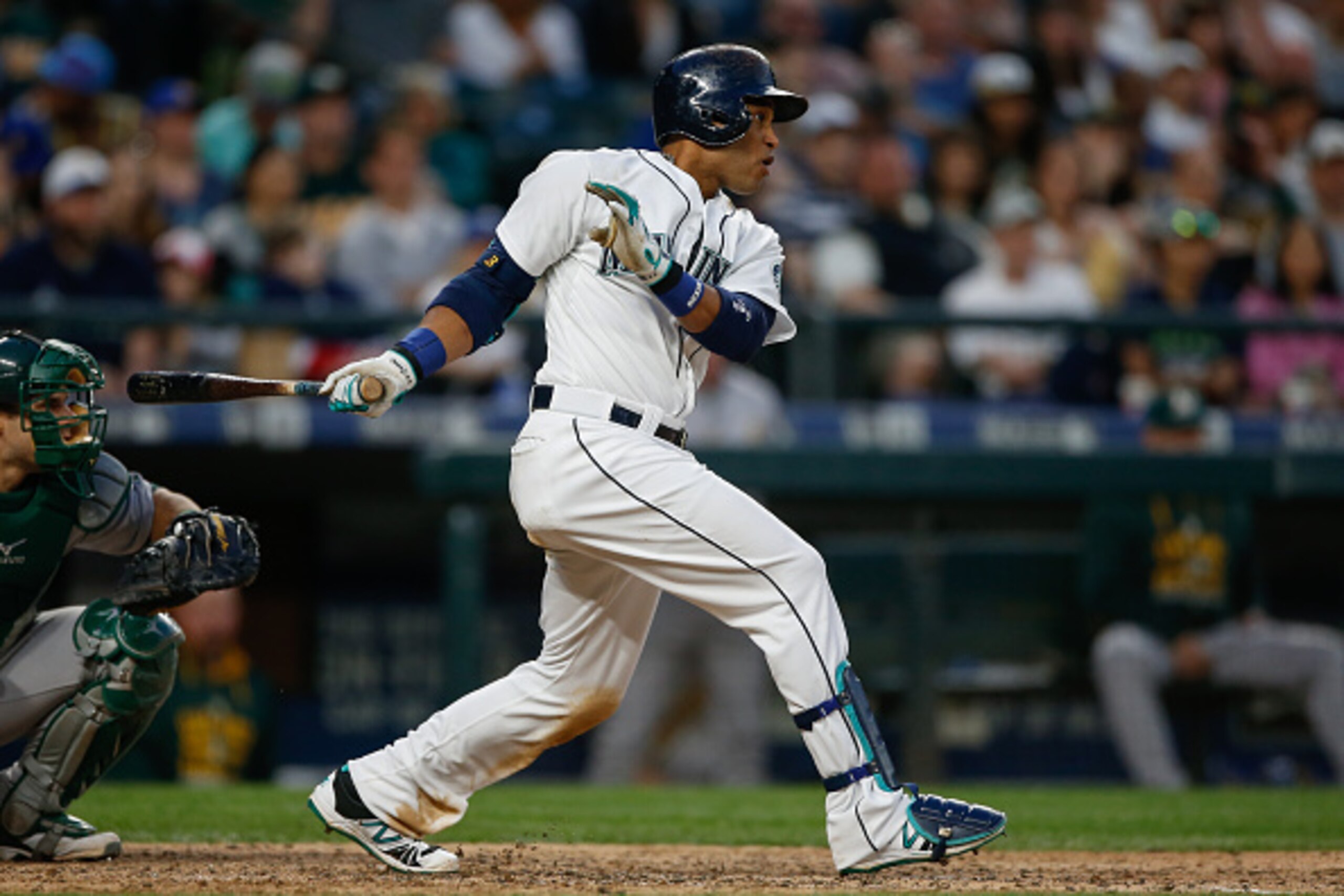 SEATTLE, WA - MAY 09:  Robinson Cano #22 of the Seattle Mariners hits an RBI single in the sixth inning against the Oakland Athletics at Safeco Field on May 9, 2015 in Seattle, Washington.  (Photo by Otto Greule Jr/Getty Images)