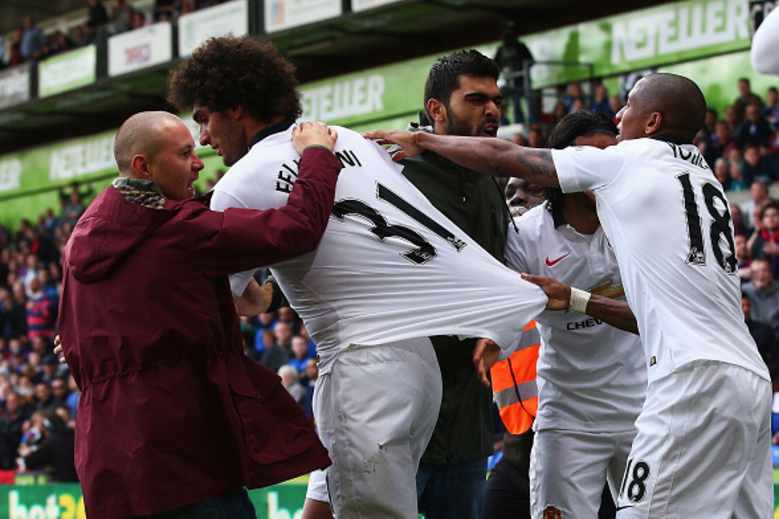LONDON, ENGLAND - MAY 09: Marouane Fellaini of Manchester United is mobbed by fans after scoring his team's second goal during the Barclays Premier League match between Crystal Palace and Manchester United at Selhurst Park on May 9, 2015 in London, Engla LONDON, ENGLAND - MAY 09: Marouane Fellaini of Manchester United is mobbed by fans after scoring his team's second goal during the Barclays Premier League match between Crystal Palace and Manchester United at Selhurst Park on May 9, 2015 in London, Engla