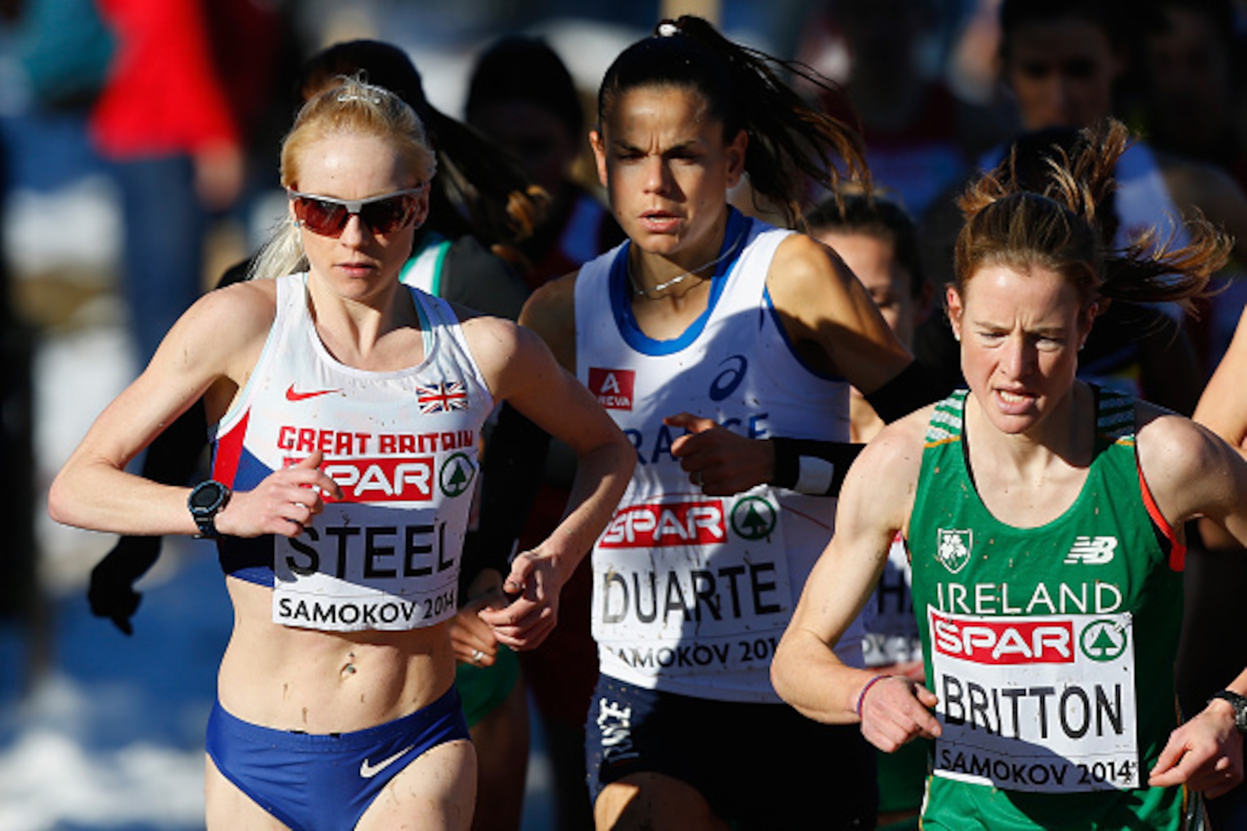 SAMOKOV, BULGARIA - DECEMBER 14:  Gemma Steel of Great Britain (L), Sophie Duarte of France (C) and Fionnuala Britton of Ireland (R) run during the Senior Women's Race during the European Cross-Country Championships on December 14, 2014 in Samokov, Bulgar