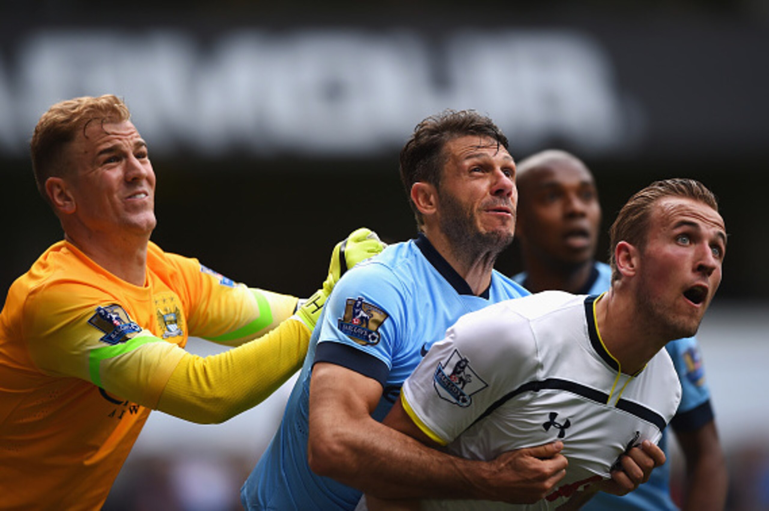 LONDON, ENGLAND - MAY 03:  Joe Hart (L) of Manchester City comes to claim the ball under pressure from Harry Kane (R) of Tottenham Hotspur with Martin Demichelis of Manchester City during the Barclays Premier League match between Tottenham Hotspur and Man