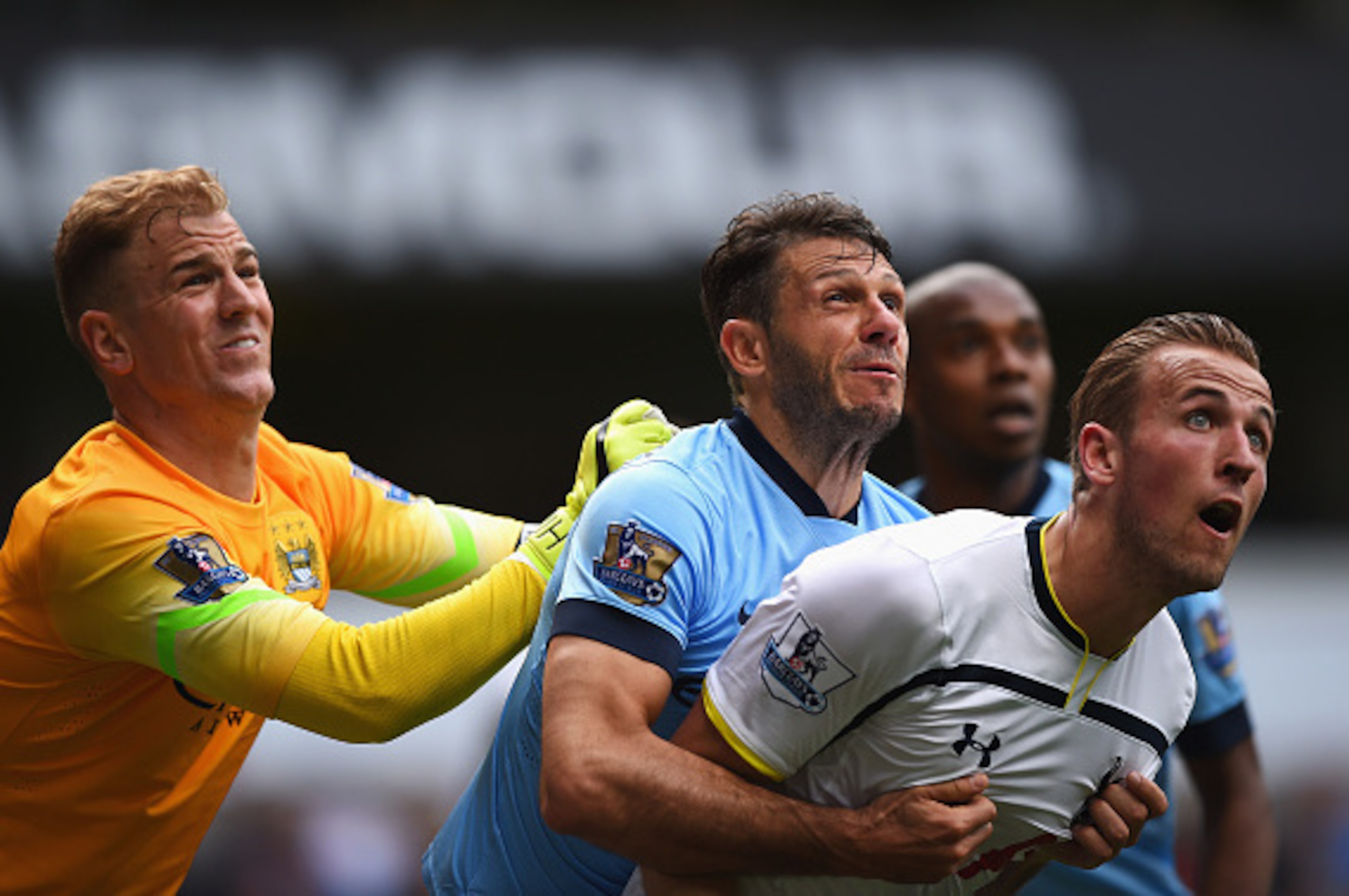 LONDON, ENGLAND - MAY 03:  Joe Hart (L) of Manchester City comes to claim the ball under pressure from Harry Kane (R) of Tottenham Hotspur with Martin Demichelis of Manchester City during the Barclays Premier League match between Tottenham Hotspur and Man