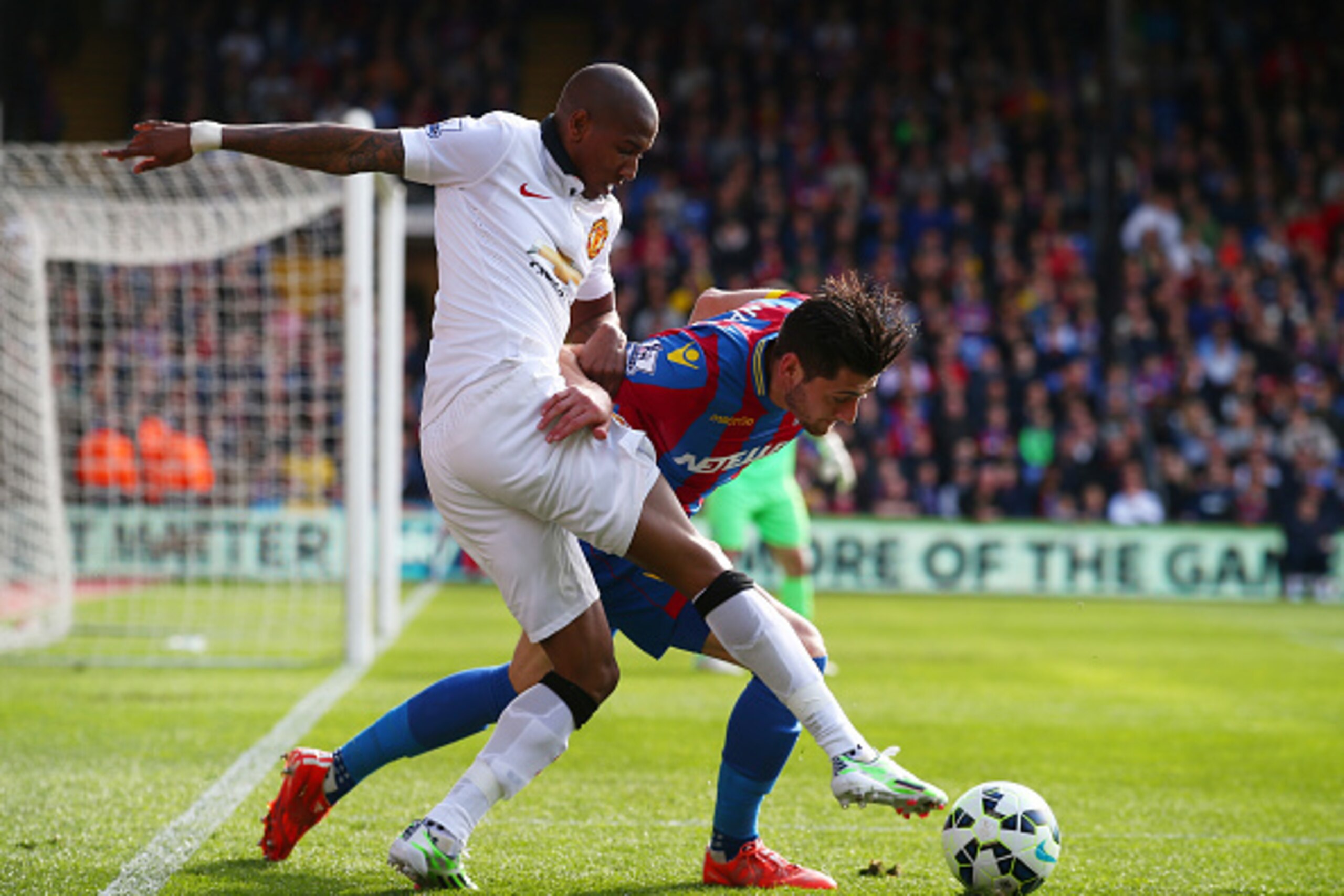 LONDON, ENGLAND - MAY 09:  Joel Ward of Crystal Palace is challenged by Ashley Young of Manchester United during the Barclays Premier League match between Crystal Palace and Manchester United at Selhurst Park on May 9, 2015 in London, England.  (Photo by 