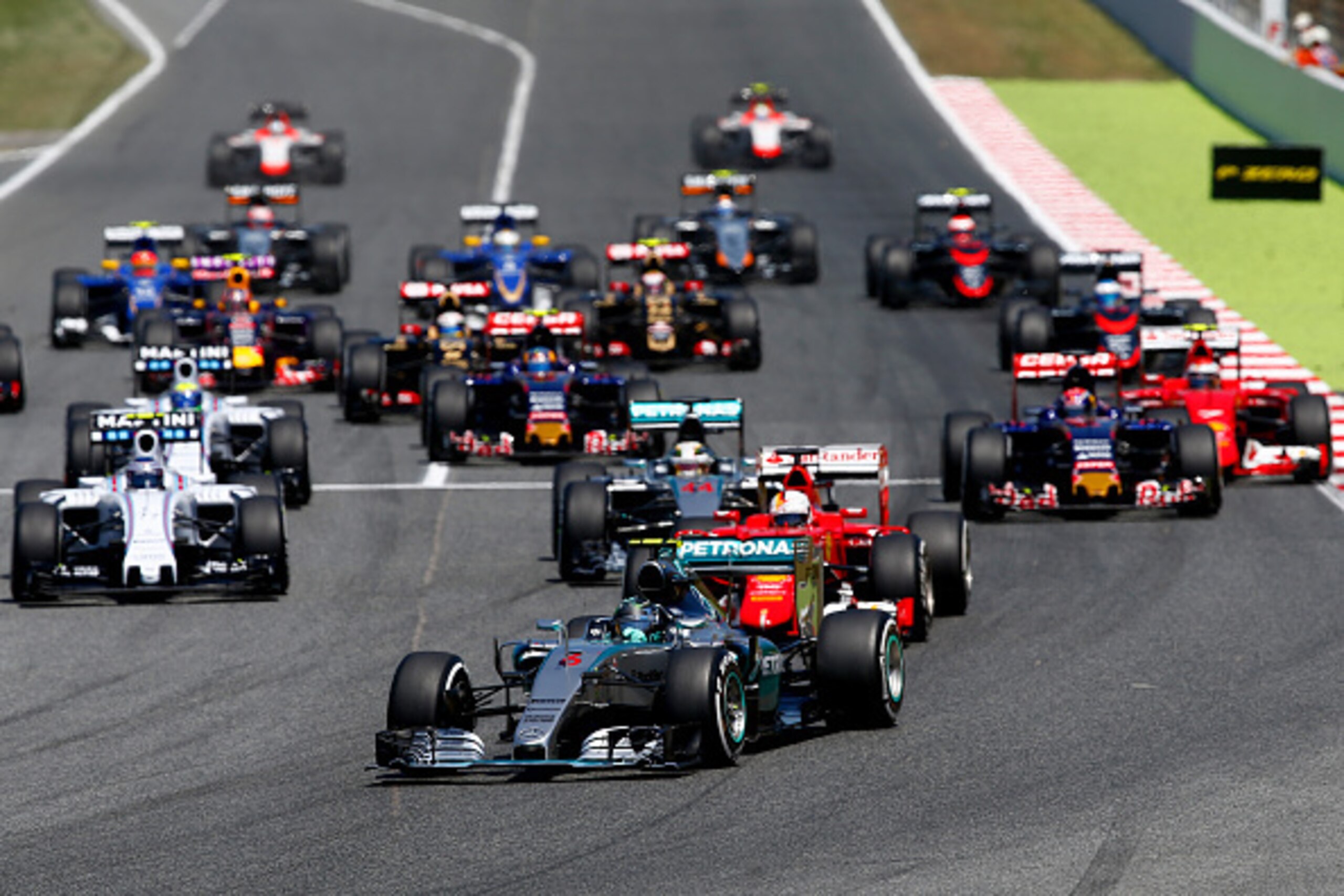 MONTMELO, SPAIN - MAY 10:  Nico Rosberg of Germany and Mercedes GP leads Sebastian Vettel of Germany and Ferrari and Lewis Hamilton of Great Britain and Mercedes GP into the first corner during the Spanish Formula One Grand Prix at Circuit de Catalunya on