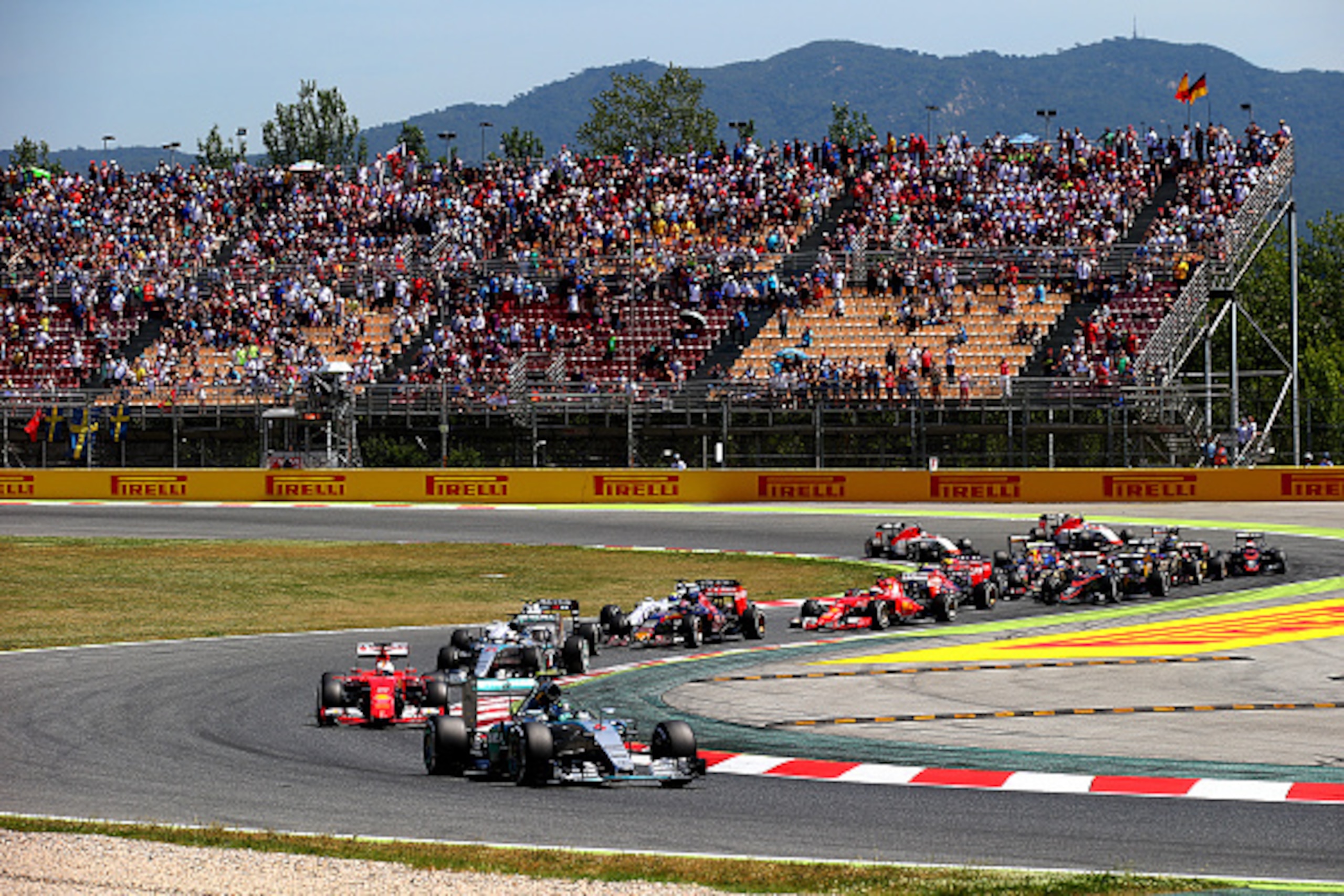 MONTMELO, SPAIN - MAY 10:  Nico Rosberg of Germany and Mercedes GP leads Sebastian Vettel of Germany and Ferrari and Lewis Hamilton of Great Britain and Mercedes GP into the second corner during the Spanish Formula One Grand Prix at Circuit de Catalunya o