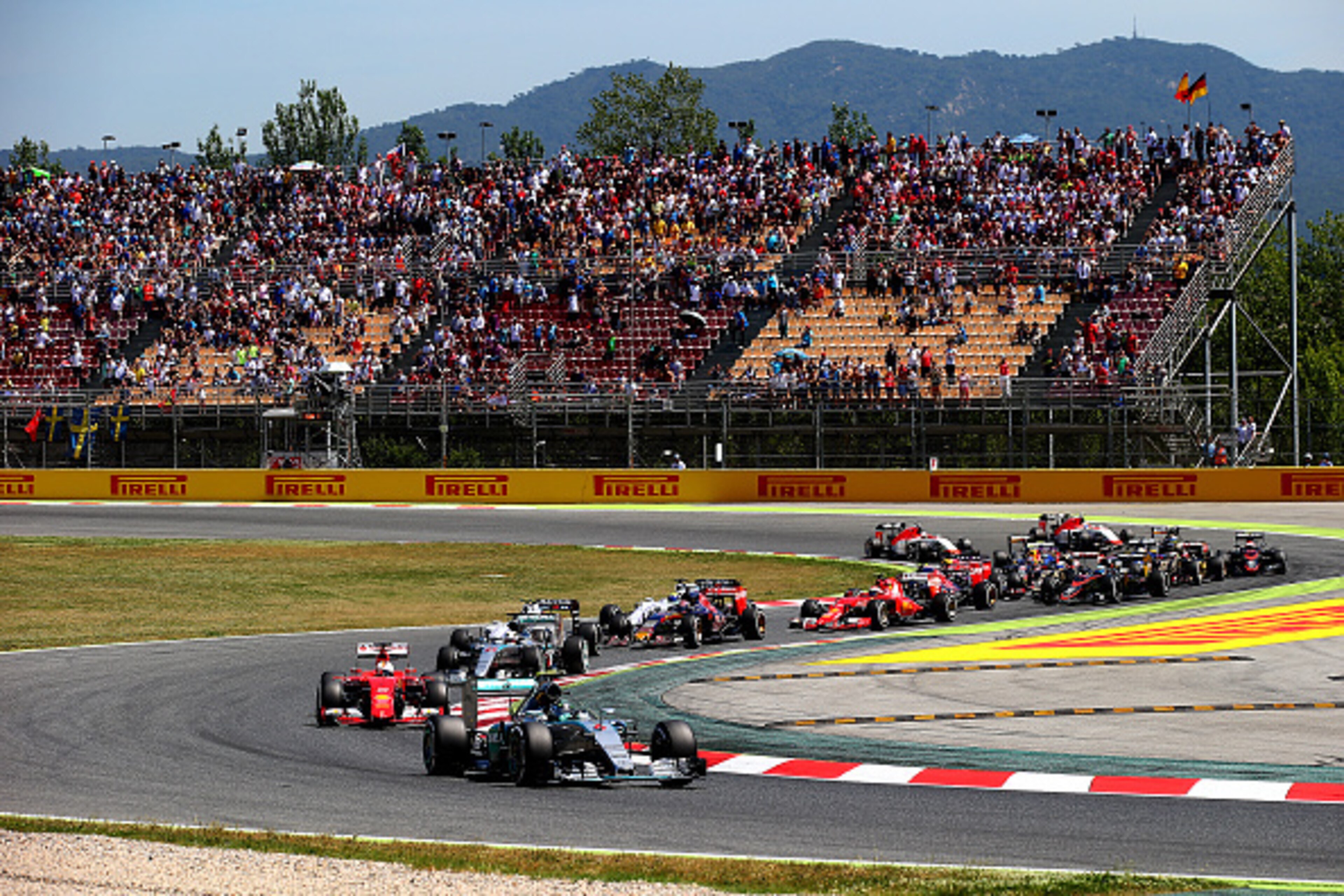 MONTMELO, SPAIN - MAY 10:  Nico Rosberg of Germany and Mercedes GP leads Sebastian Vettel of Germany and Ferrari and Lewis Hamilton of Great Britain and Mercedes GP into the second corner during the Spanish Formula One Grand Prix at Circuit de Catalunya o