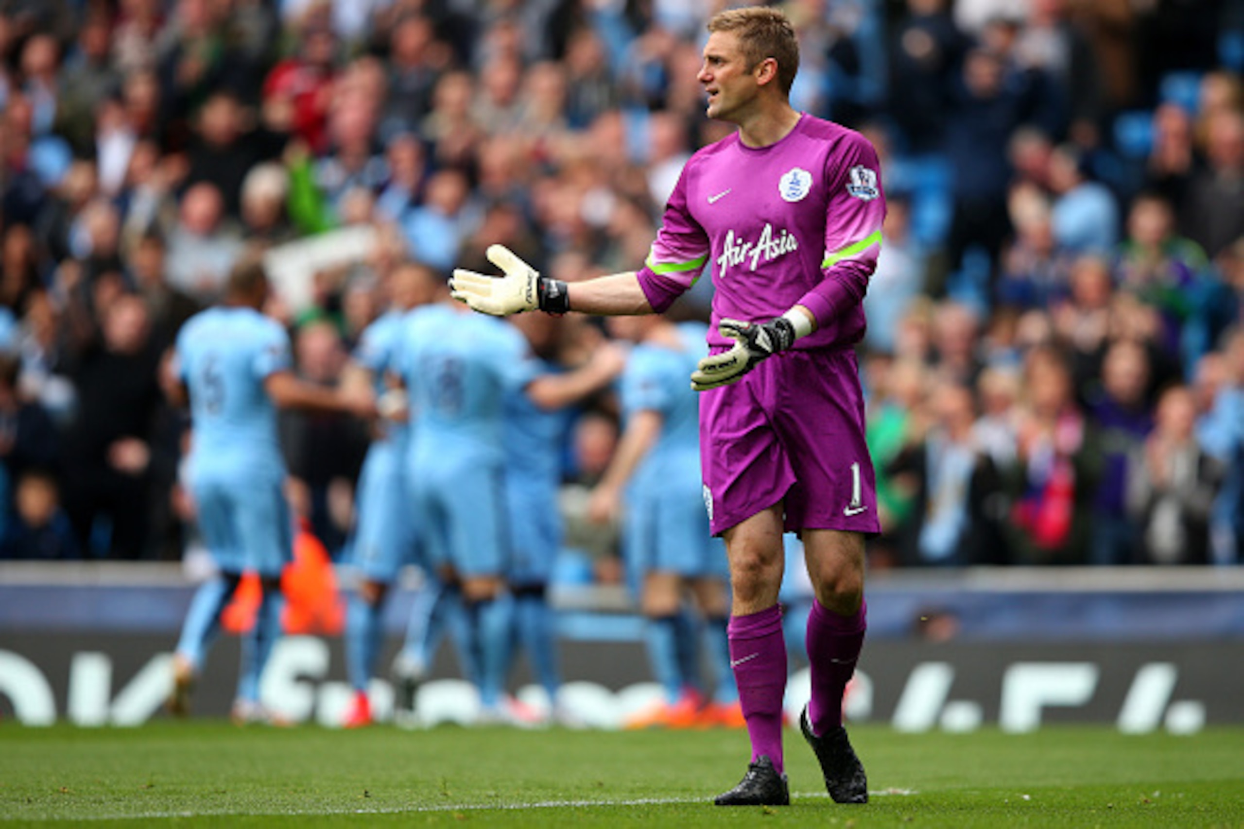 MANCHESTER, ENGLAND - MAY 10: Dejected goalkeeper Robert Green of QPR reacts after conceding the opeing goal to Sergio Aguero of Manchester City during the Barclays Premier League match between Manchester City and Queens Park Rangers at the Etihad Stadiu MANCHESTER, ENGLAND - MAY 10: Dejected goalkeeper Robert Green of QPR reacts after conceding the opeing goal to Sergio Aguero of Manchester City during the Barclays Premier League match between Manchester City and Queens Park Rangers at the Etihad Stadiu