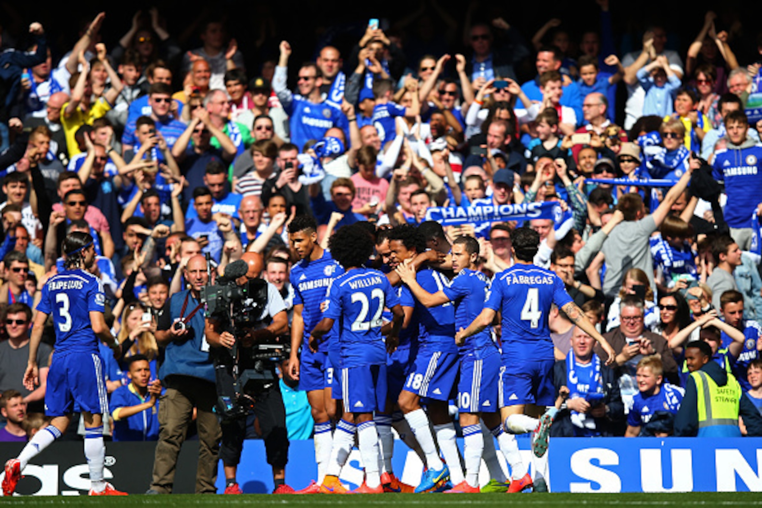 LONDON, ENGLAND - MAY 10:  John Terry (obscured) of Chelsea is congratulated by teammates after scoring the opening goal during the Barclays Premier League match between Chelsea and Liverpool at Stamford Bridge on May 10, 2015 in London, England.  (Photo 