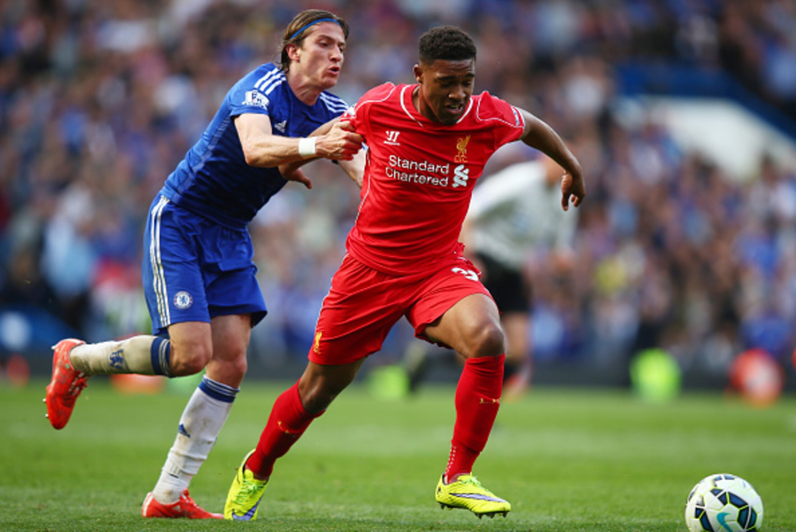LONDON, ENGLAND - MAY 10:  Jordon Ibe of Liverpool is held back by Filipe Luis of Chelsea during the Barclays Premier League match between Chelsea and Liverpool at Stamford Bridge on May 10, 2015 in London, England.  (Photo by Clive Rose/Getty Images)