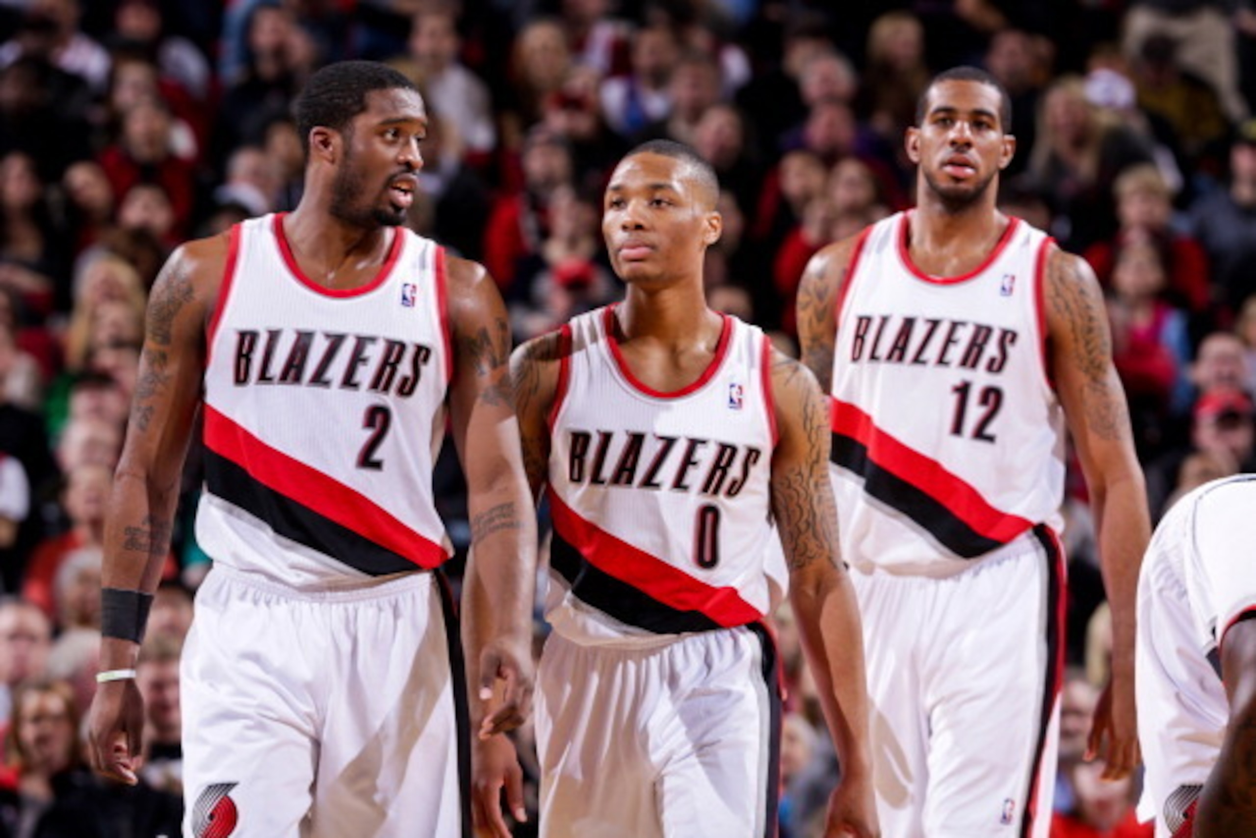 PORTLAND, OR - JANUARY 13: Portland Trail Blazers players Wesley Matthews #2, Damian Lillard #0 and LaMarcus Aldridge #12 wait to resume action against the Oklahoma City Thunder on January 13, 2013 at the Rose Garden Arena in Portland, Oregon. NOTE TO USE