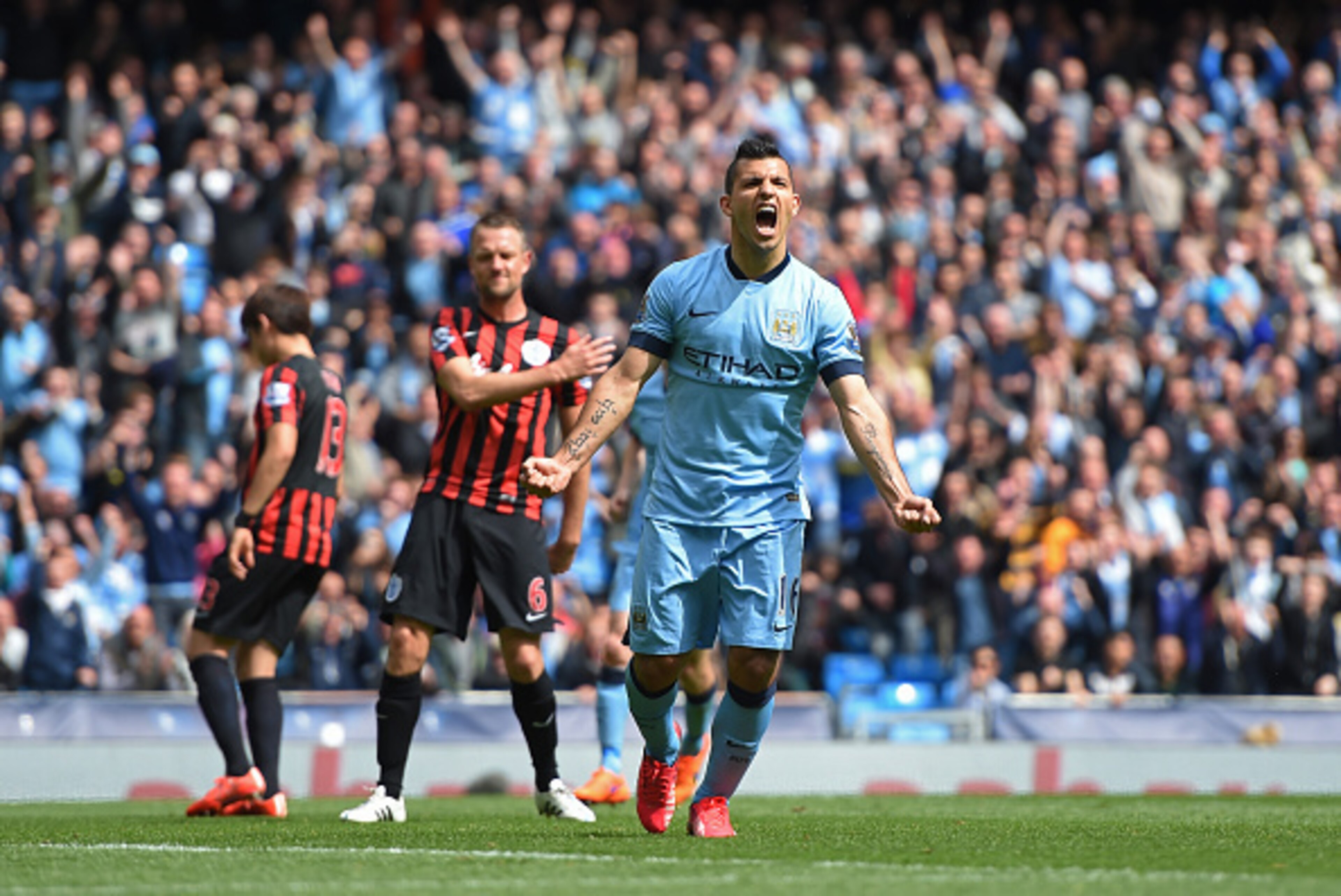 MANCHESTER, ENGLAND - MAY 10:  Sergio Aguero of Manchester City celebrates after scoring his team's fourth goal from the penalty spot during the Barclays Premier League match between Manchester City and Queens Park Rangers at the Etihad Stadium on May 10,