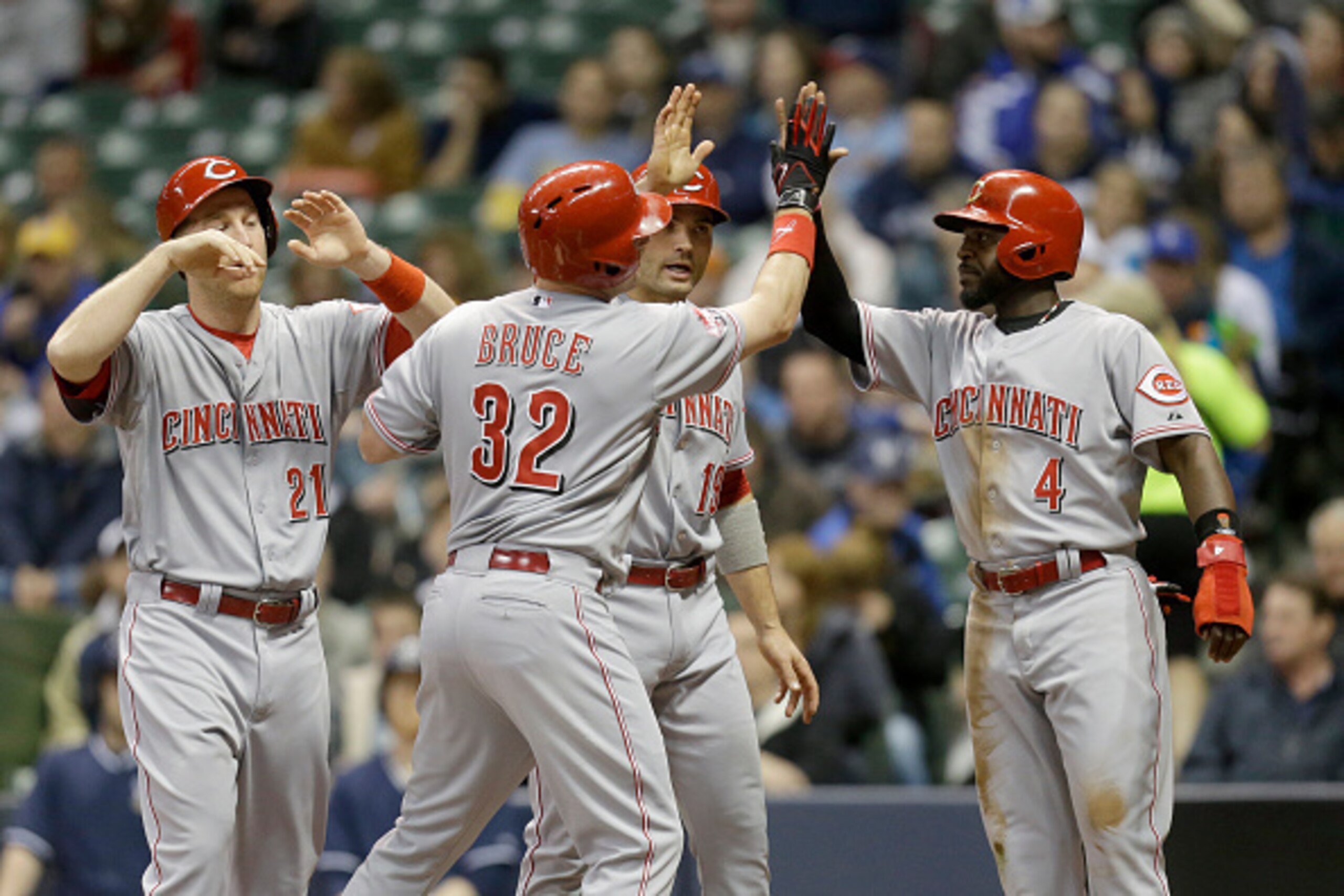 MILWAUKEE, WI - APRIL 21: Jay Bruce #32 of the Cincinnati Reds celebrates with Todd Frazier #21, Joey Votto #19 and Brandon Phillips #4 after hitting a grand slam in the third inning against the Milwaukee Brewers at Miller Park on April 21, 2015 in Milwau