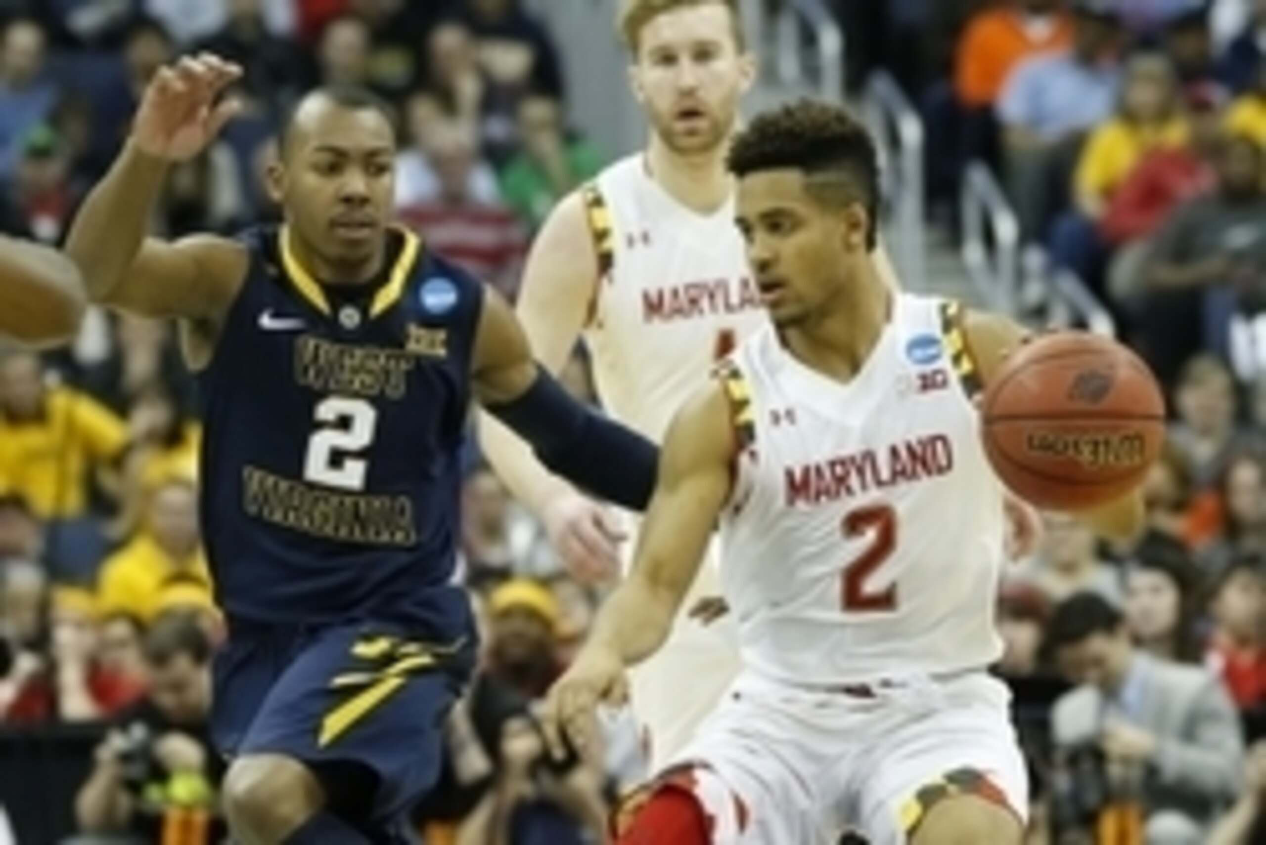 Mar 22, 2015; Columbus, OH, USA; Maryland Terrapins guard Melo Trimble (2) dribbles against West Virginia Mountaineers guard Jevon Carter (2)  during the first half in the third round of the 2015 NCAA Tournament at Nationwide Arena. Mandatory Credit: Greg
