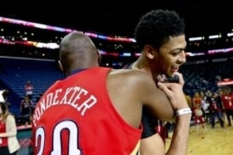 Apr 15, 2015; New Orleans, LA, USA; New Orleans Pelicans forward Anthony Davis (23) celebrates with guard Quincy Pondexter (20) after defeating the San Antonio Spurs at the Smoothie King Center.The Pelicans won 108-103 to earn the eight seed in the Wester