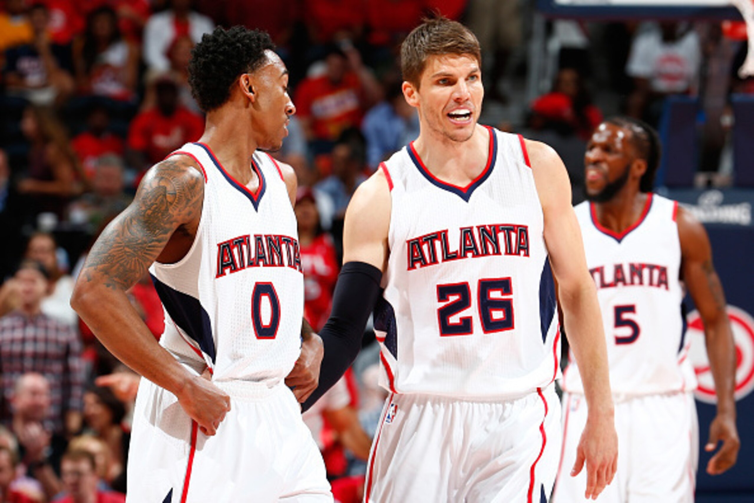 ATLANTA, GA - MAY 05:  Kyle Korver #26 of the Atlanta Hawks converses with Jeff Teague #0 during Game Two of the Eastern Conference Semifinals of the 2015 NBA Playoffs against the Washington Wizards at Philips Arena on May 5, 2015 in Atlanta, Georgia.  NO
