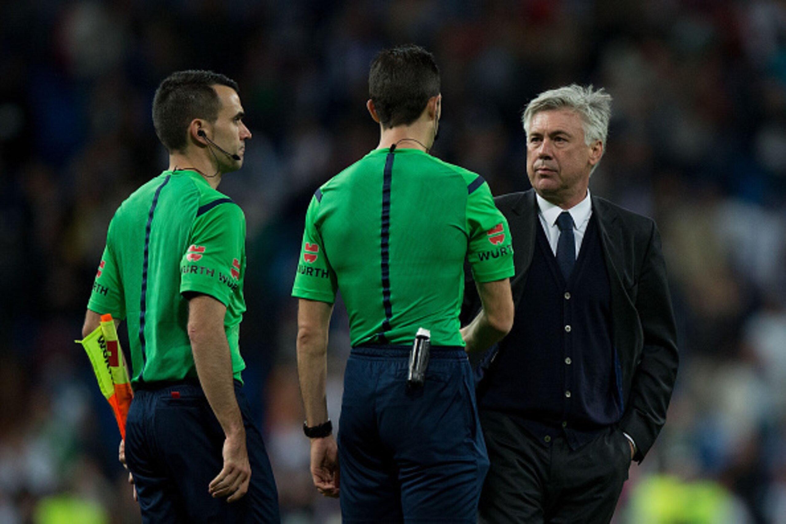 MADRID, SPAIN - APRIL 18: Head coach Carlo Ancelotti (R) of Real Madrid CF shake hands with referee Inaki Vicandi (2ndR) after the La Liga match between Real Madrid CF and Malaga CF at Estadio Santiago Bernabeu on April 18, 2015 in Madrid, Spain. (Photo MADRID, SPAIN - APRIL 18: Head coach Carlo Ancelotti (R) of Real Madrid CF shake hands with referee Inaki Vicandi (2ndR) after the La Liga match between Real Madrid CF and Malaga CF at Estadio Santiago Bernabeu on April 18, 2015 in Madrid, Spain. (Photo