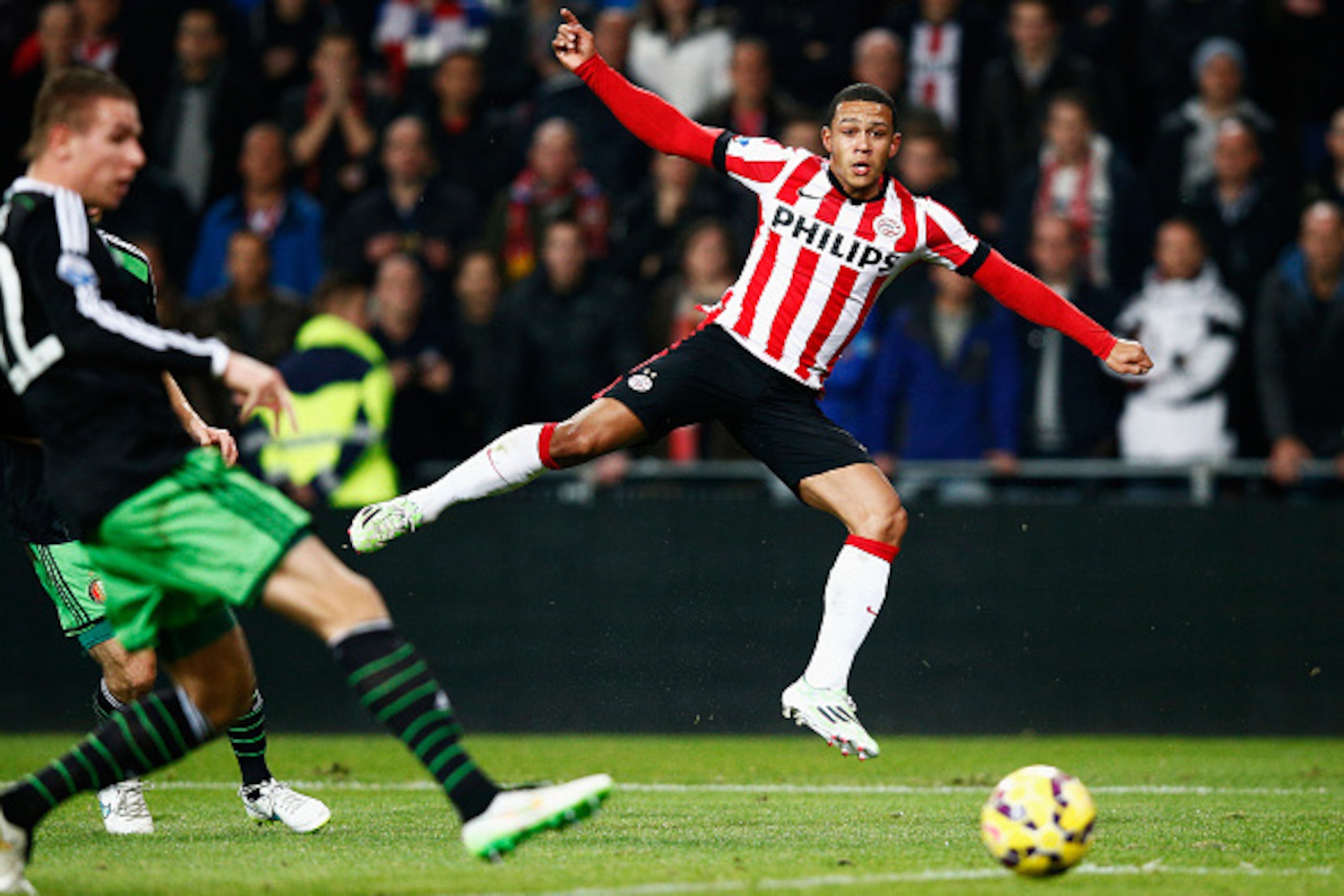 EINDHOVEN, NETHERLANDS - DECEMBER 17:  Memphis Depay of PSV shoots on goal during the Eredivisie match between PSV Eindhoven and Feyenoord Rotterdam held at the Philips Stadion on December 17, 2014 in Eindhoven, Netherlands.  (Photo by Dean Mouhtaropoulos