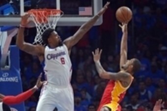 May 10, 2015; Los Angeles, CA, USA; Los Angeles Clippers center DeAndre Jordan (6) blocks a shot by Houston Rockets forward Trevor Ariza (1) in game three of the second round of the NBA Playoffs at Staples Center.  The Clippers defeated the Rockets 128-95