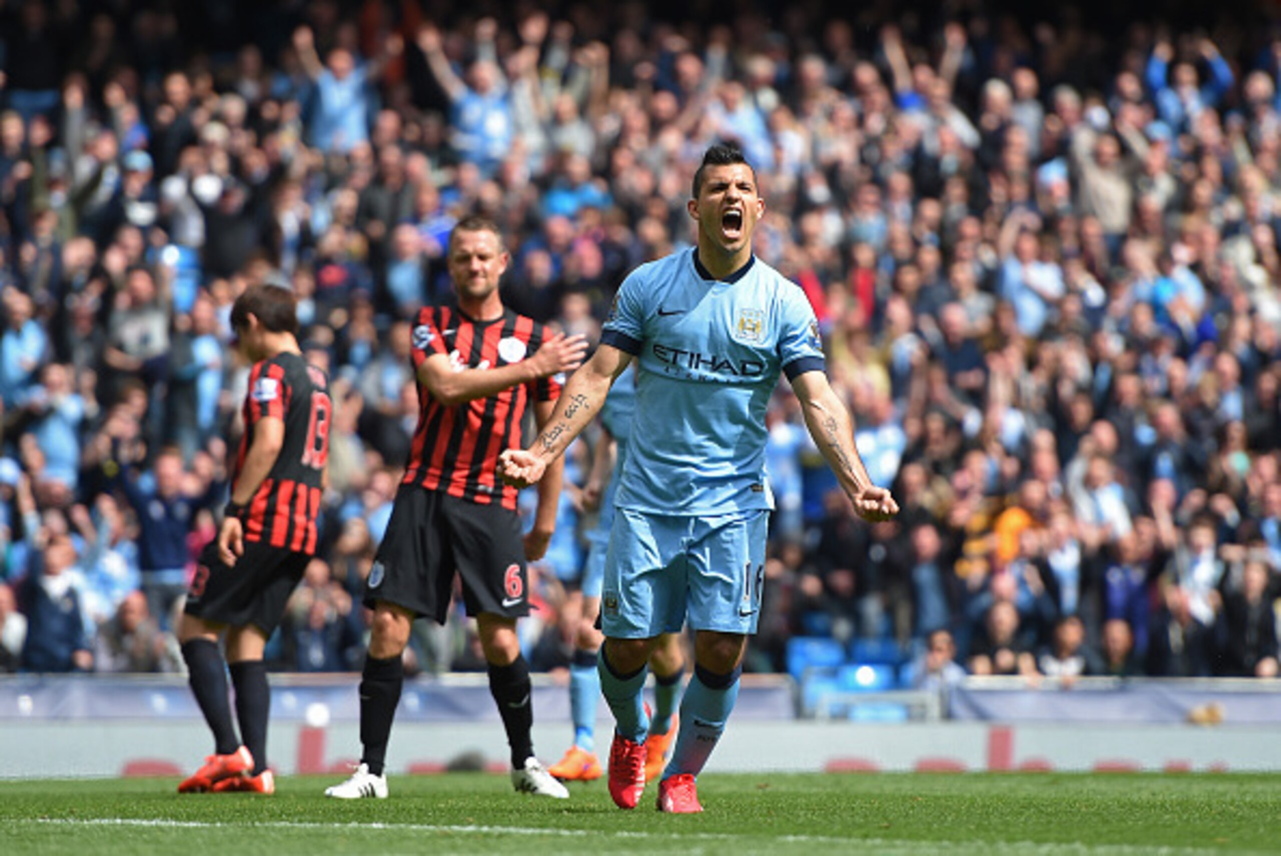 MANCHESTER, ENGLAND - MAY 10:  Sergio Aguero of Manchester City celebrates after scoring his team's fourth goal from the penalty spot during the Barclays Premier League match between Manchester City and Queens Park Rangers at the Etihad Stadium on May 10,