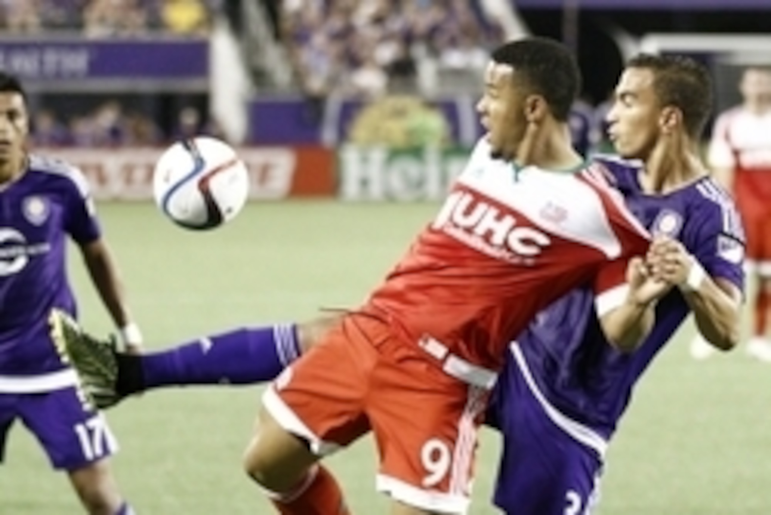 May 8, 2015; Orlando, FL, USA; New England Revolution forward Charlie Davies (9) and Orlando City FC Seb Hines (3) battle for the ball during the first half of an MLS soccer match at Orlando Citrus Bowl Stadium. Mandatory Credit: Reinhold Matay-USA TODAY 