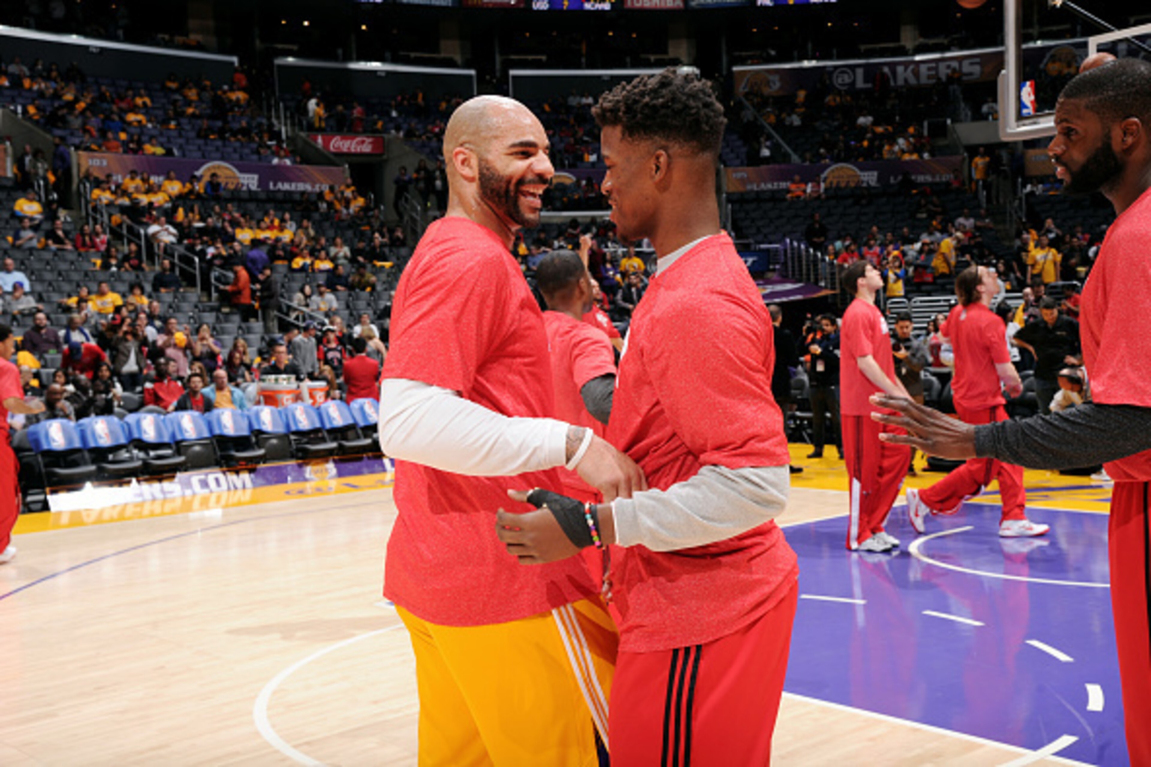 LOS ANGELES, CA - JANUARY 29: Carlos Boozer #5 of the Los Angeles Lakers and Jimmy Butler #21 of the Chicago Bulls exchange words before a game at STAPLES Center on January 29, 2015 in Los Angeles, California. NOTE TO USER: User expressly acknowledges and