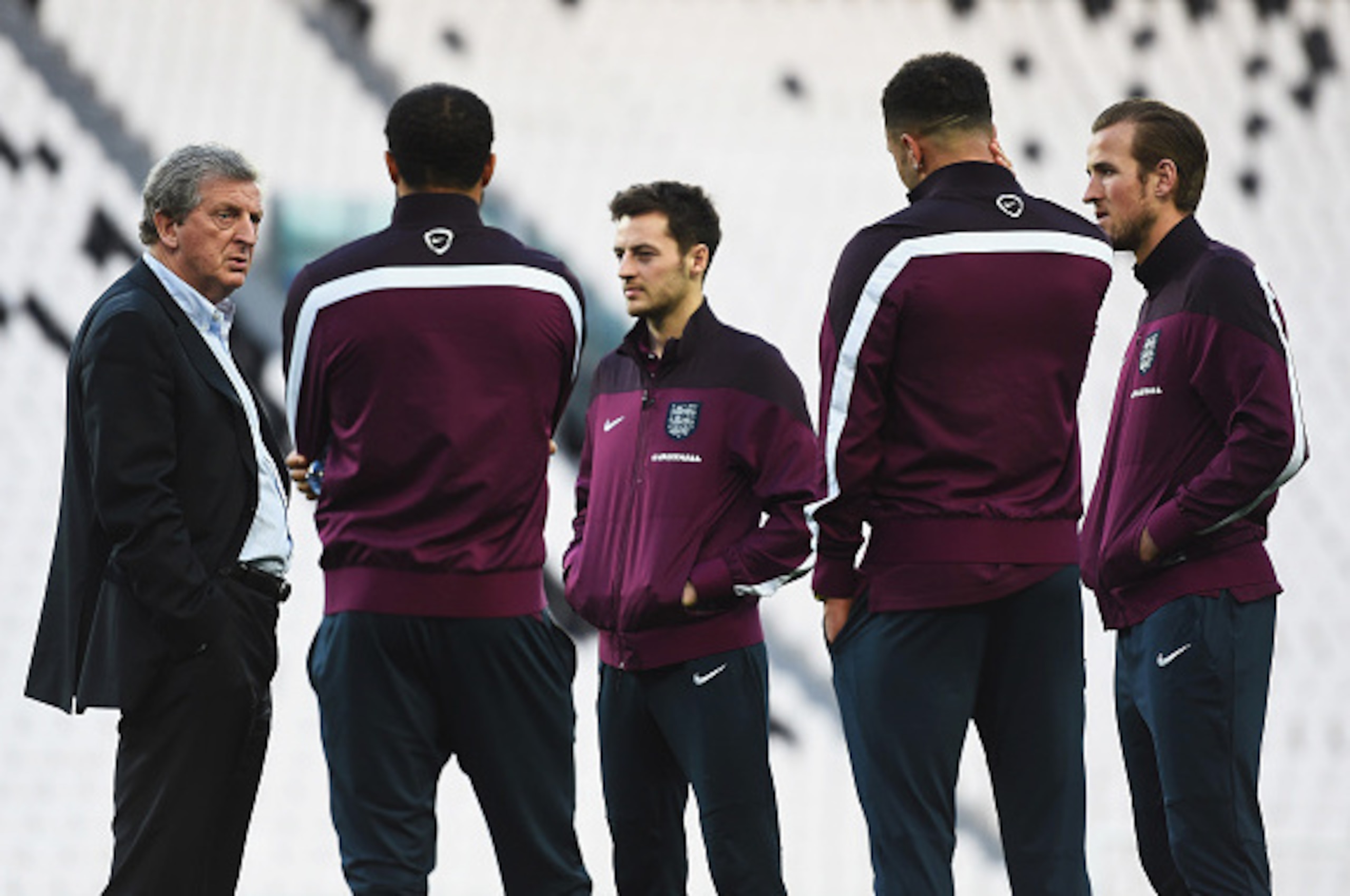 TURIN, ITALY - MARCH 30:  Manager Roy Hodgson (L) of England talks to Andros Townsend, Ryan Mason, Kyle Walker and Harry Kane during an England team stadium visit ahead of the International Friendly match against Italy at Juventus Arena on March 30, 2015 