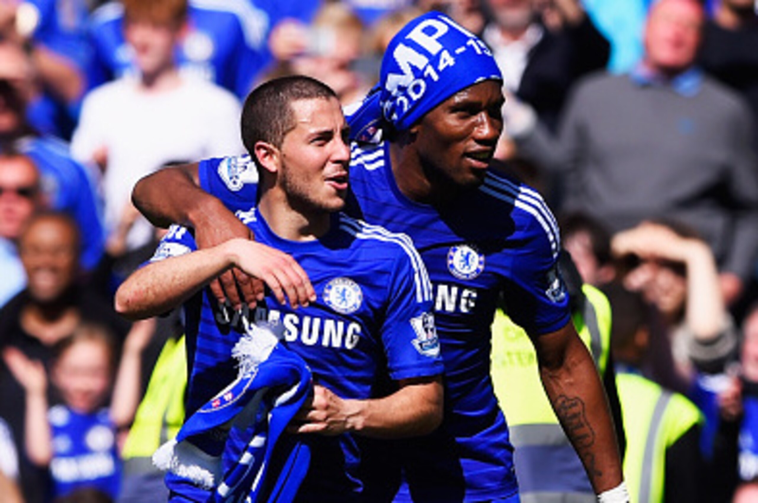 LONDON, ENGLAND - MAY 03:  Eden Hazard (L) and Didier Drogba of Chelsea celebrate winning the Premier League title after the Barclays Premier League match between Chelsea and Crystal Palace at Stamford Bridge on May 3, 2015 in London, England. Chelsea bec
