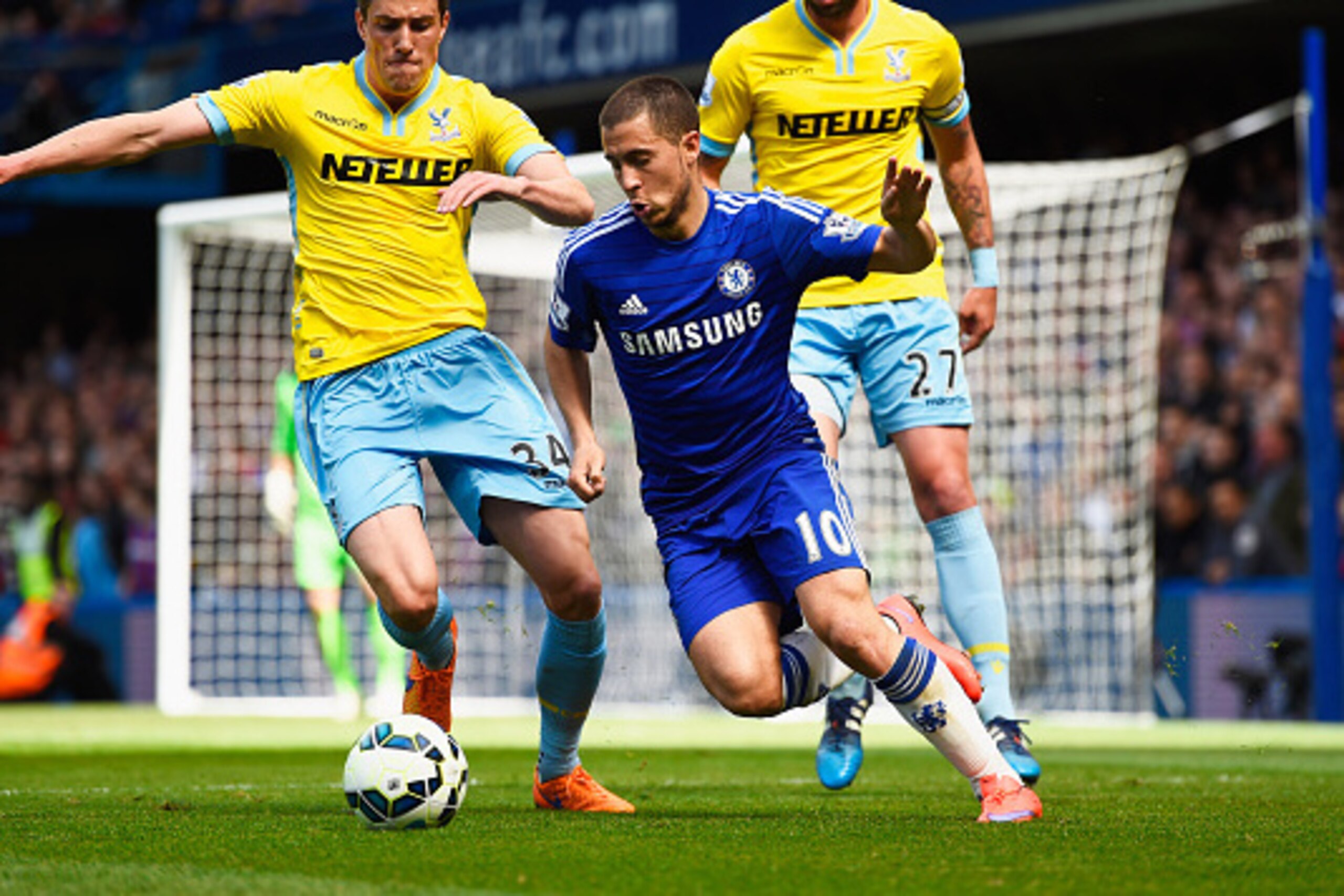 LONDON, ENGLAND - MAY 03:  Eden Hazard of Chelsea is watched by Martin Kelly (L) and Damien Delaney of Crystal Palace (R) during the Barclays Premier League match between Chelsea and Crystal Palace at Stamford Bridge on May 3, 2015 in London, England.  (P