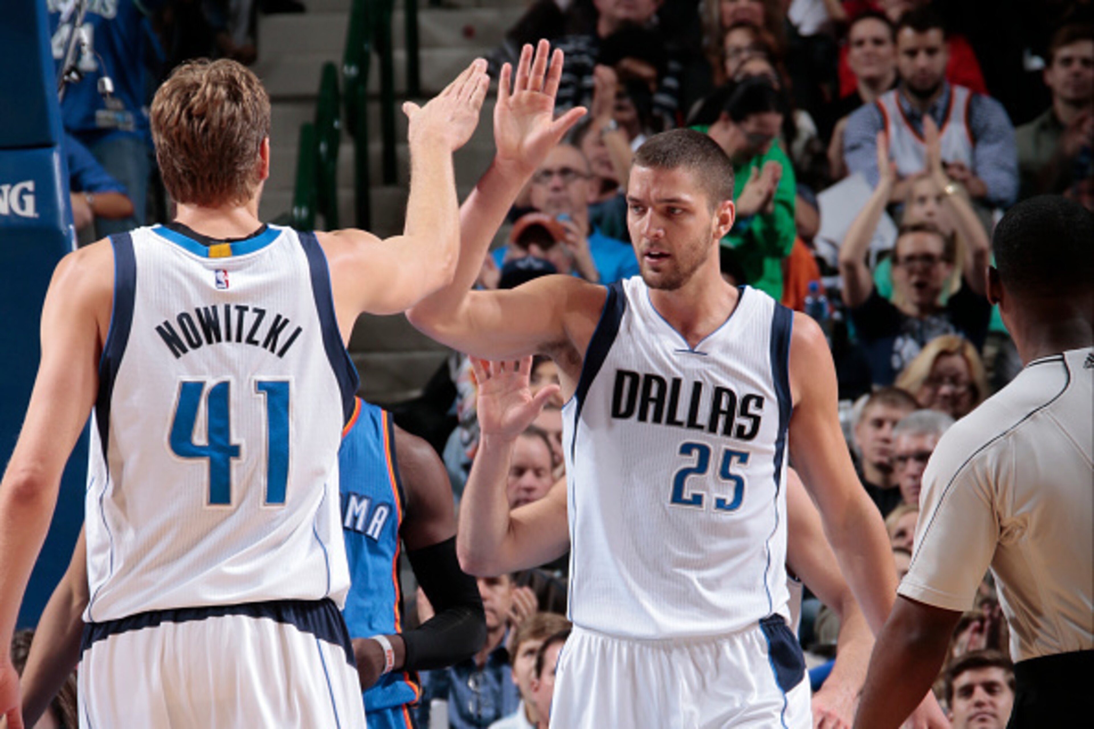 DALLAS, TX - DECEMBER 28: Chandler Parsons #25 and Dirk Nowitzki #41 of the Dallas Mavericks high five during a game against the Oklahoma City Thunder on December 28, 2014 at the American Airlines Center in Dallas, Texas. NOTE TO USER: User expressly ackn