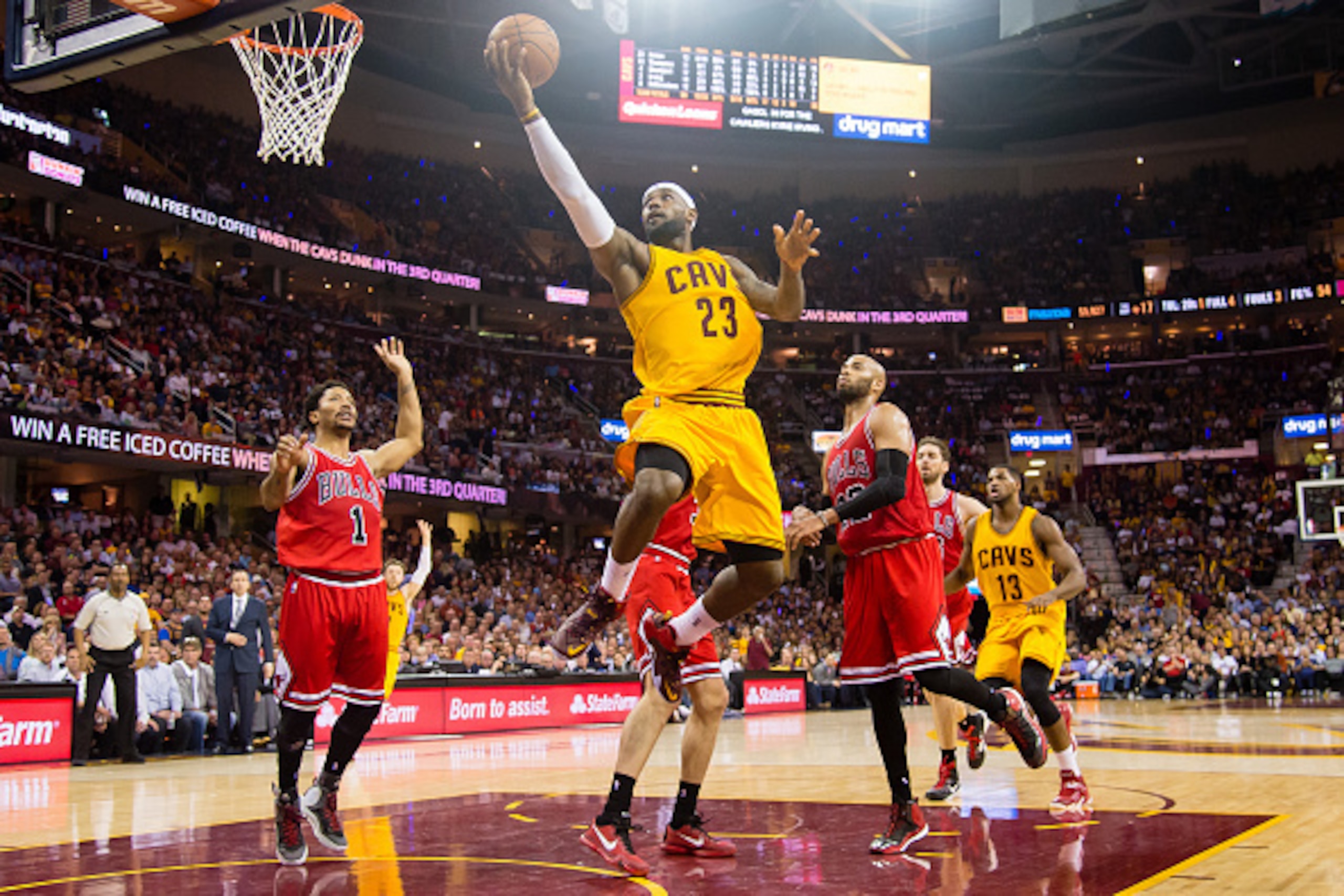 CLEVELAND, OH - MAY 6: LeBron James #23 of the Cleveland Cavaliers goes up for a shot over Derrick Rose #1 and Taj Gibson #22 of the Chicago Bulls in the first half during Game Two in the Eastern Conference Semifinals of the 2015 NBA Playoffs 2015 at Quic CLEVELAND, OH - MAY 6: LeBron James #23 of the Cleveland Cavaliers goes up for a shot over Derrick Rose #1 and Taj Gibson #22 of the Chicago Bulls in the first half during Game Two in the Eastern Conference Semifinals of the 2015 NBA Playoffs 2015 at Quic